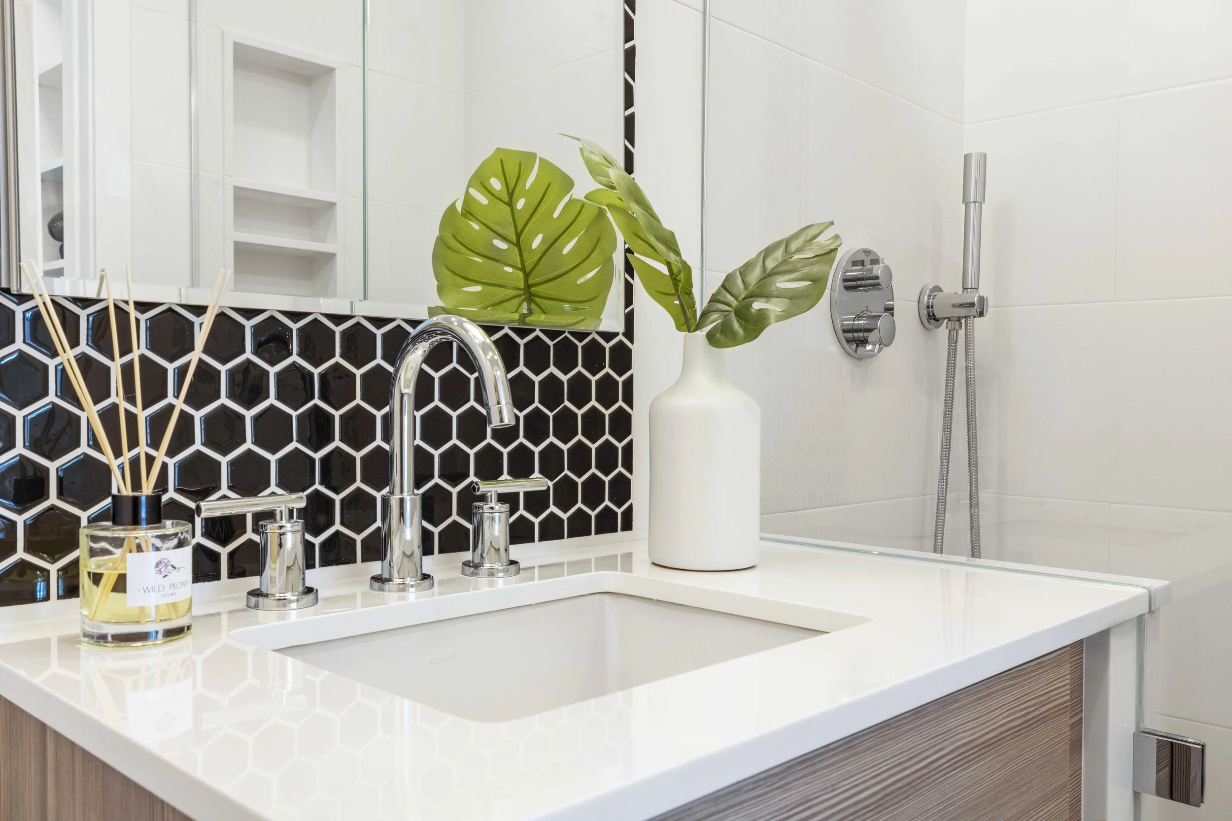 Detail view of the vanity and tile in the Gramercy Arms NYC bathroom.