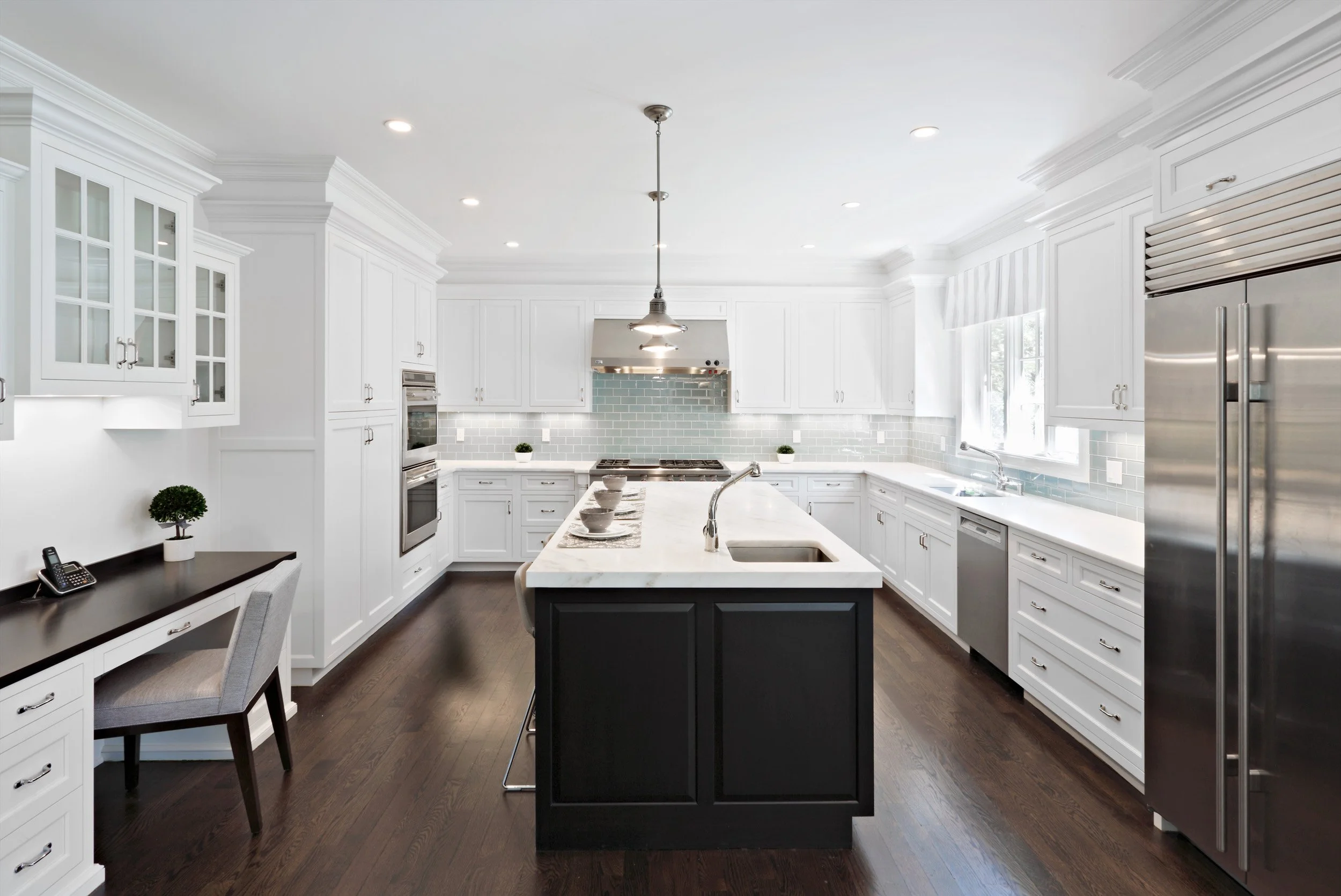 Kitchen in Parkfield House in Scarsdale NY home with large island by Luminosus Designs.