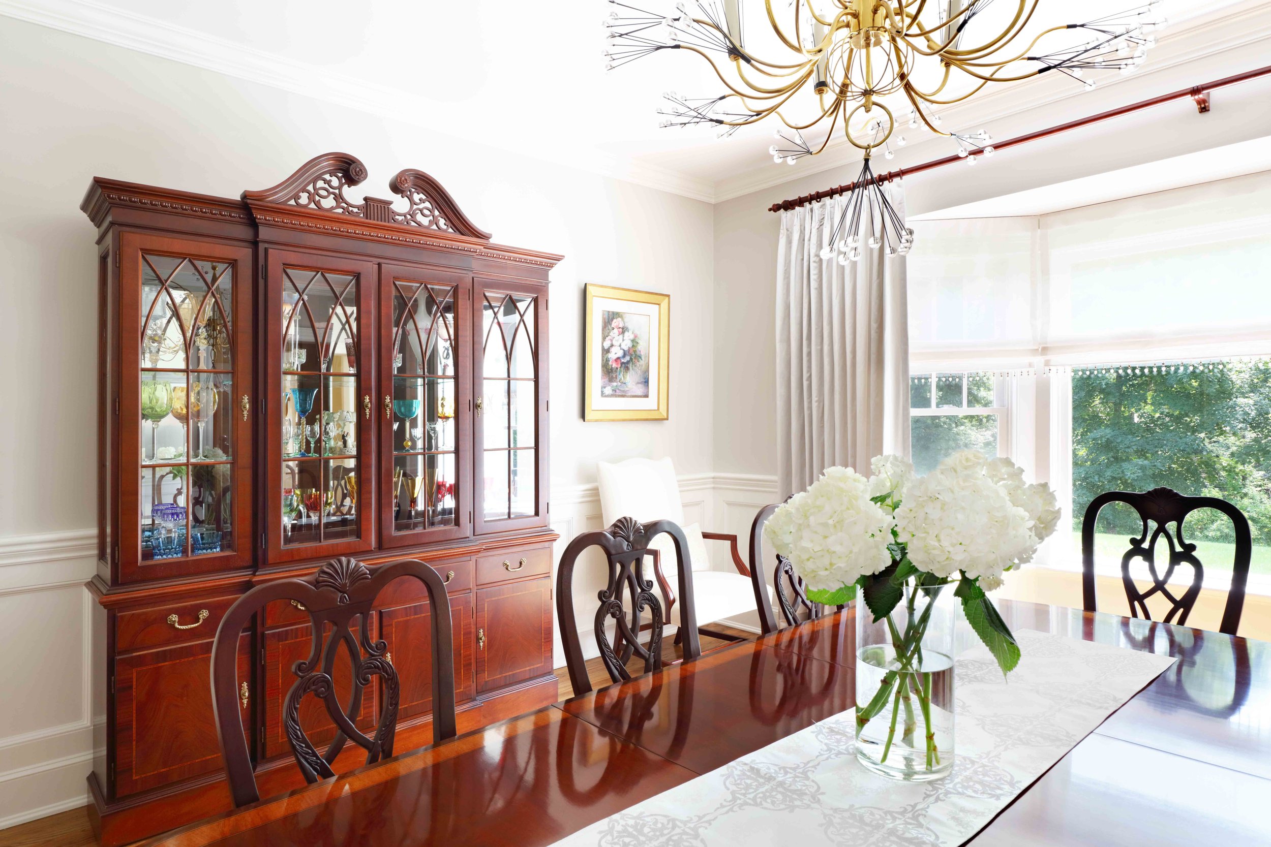 Dining Room featuring china cabinet and dining table styling at Lismore House in Greenwich, CT.