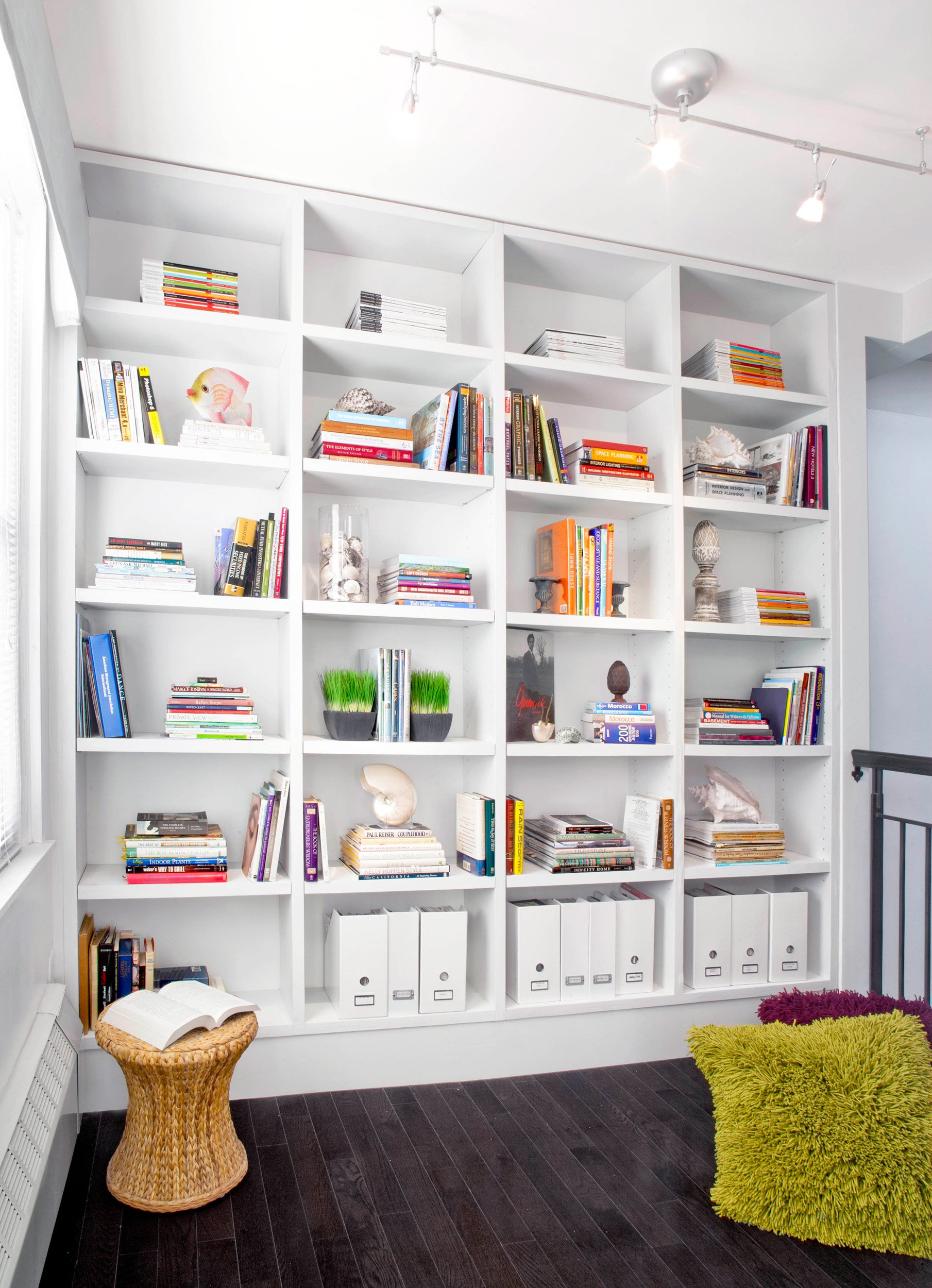 Close-up of library at the Muliner House in Bronx, NY featuring custom built-in bookcase.