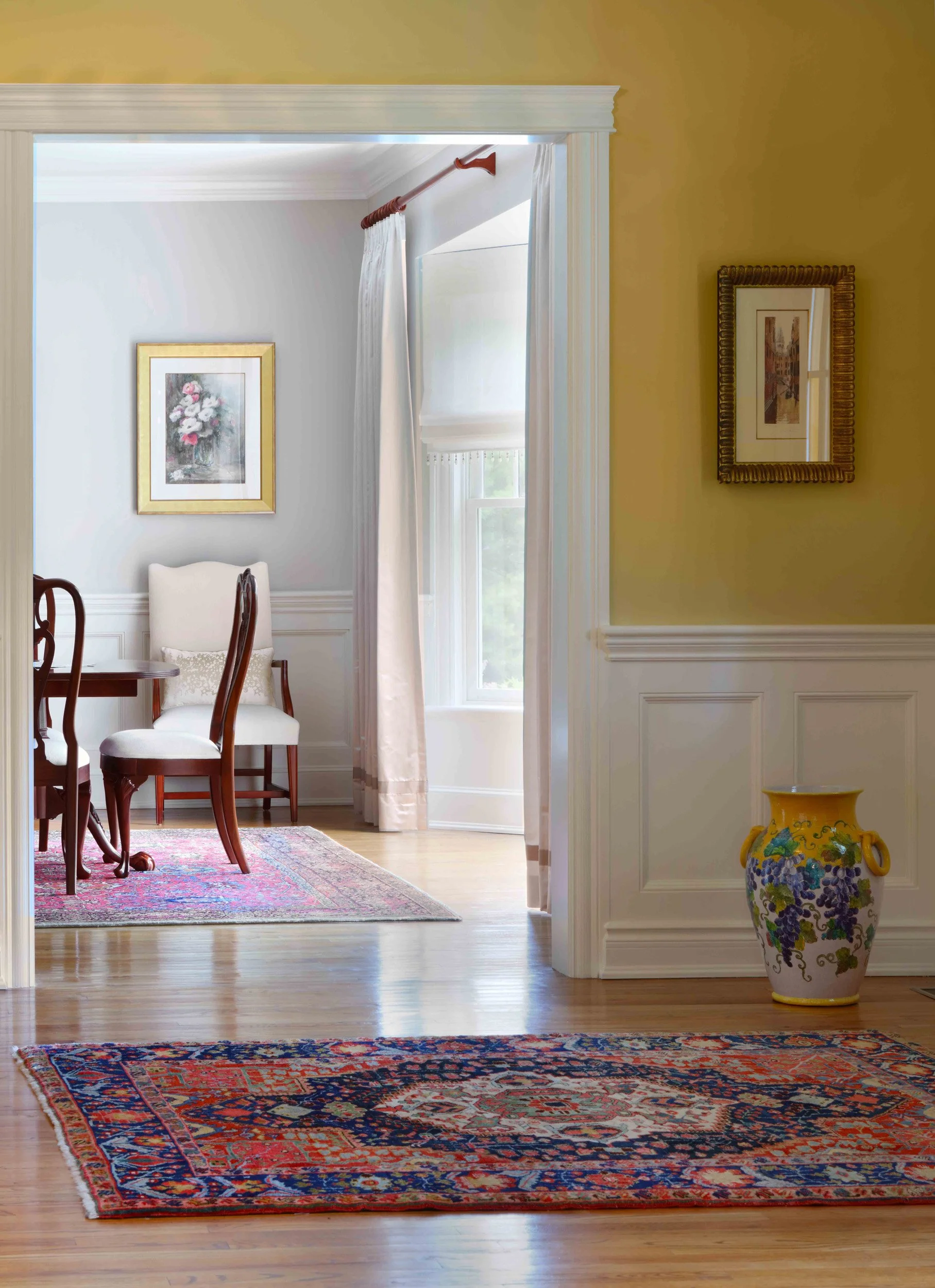 Foyer featuring decorative venetian mask at Lismore House in Greenwich, CT.