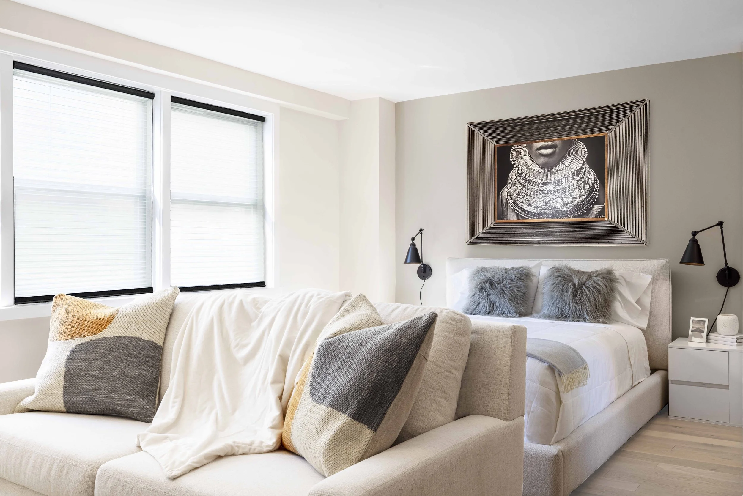 Wide view of the Gramercy Arms sleeping alcove in New York City, featuring dramatic art, soft textiles, and thoughtful space planning by Luminosus Designs.