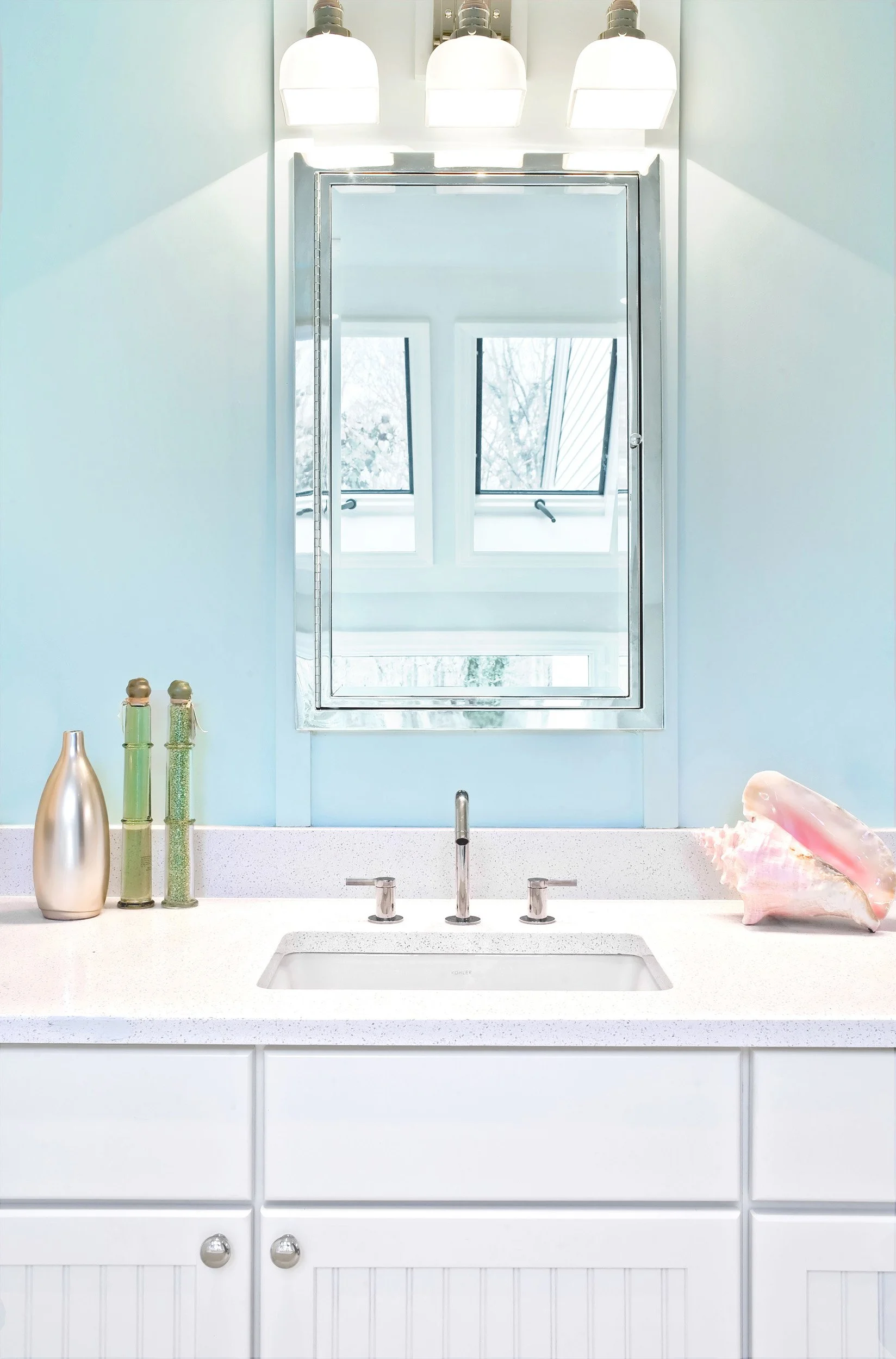 Close-up of a custom bathroom vanity with integrated storage in the Deerfield primary bathroom in Pleasantville, NY.