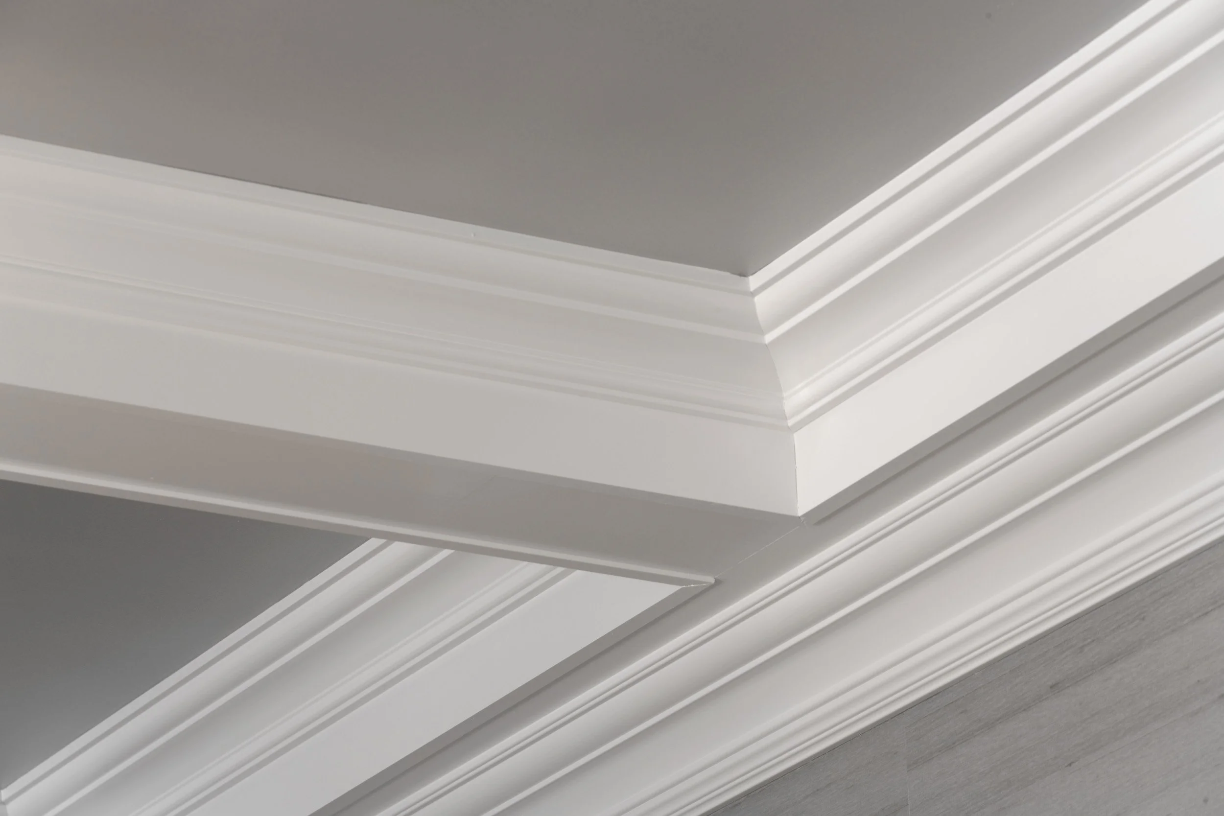 Coffered ceiling with silver leaf detail  in formal dining room in Parkfield House in Scarsdale NY.