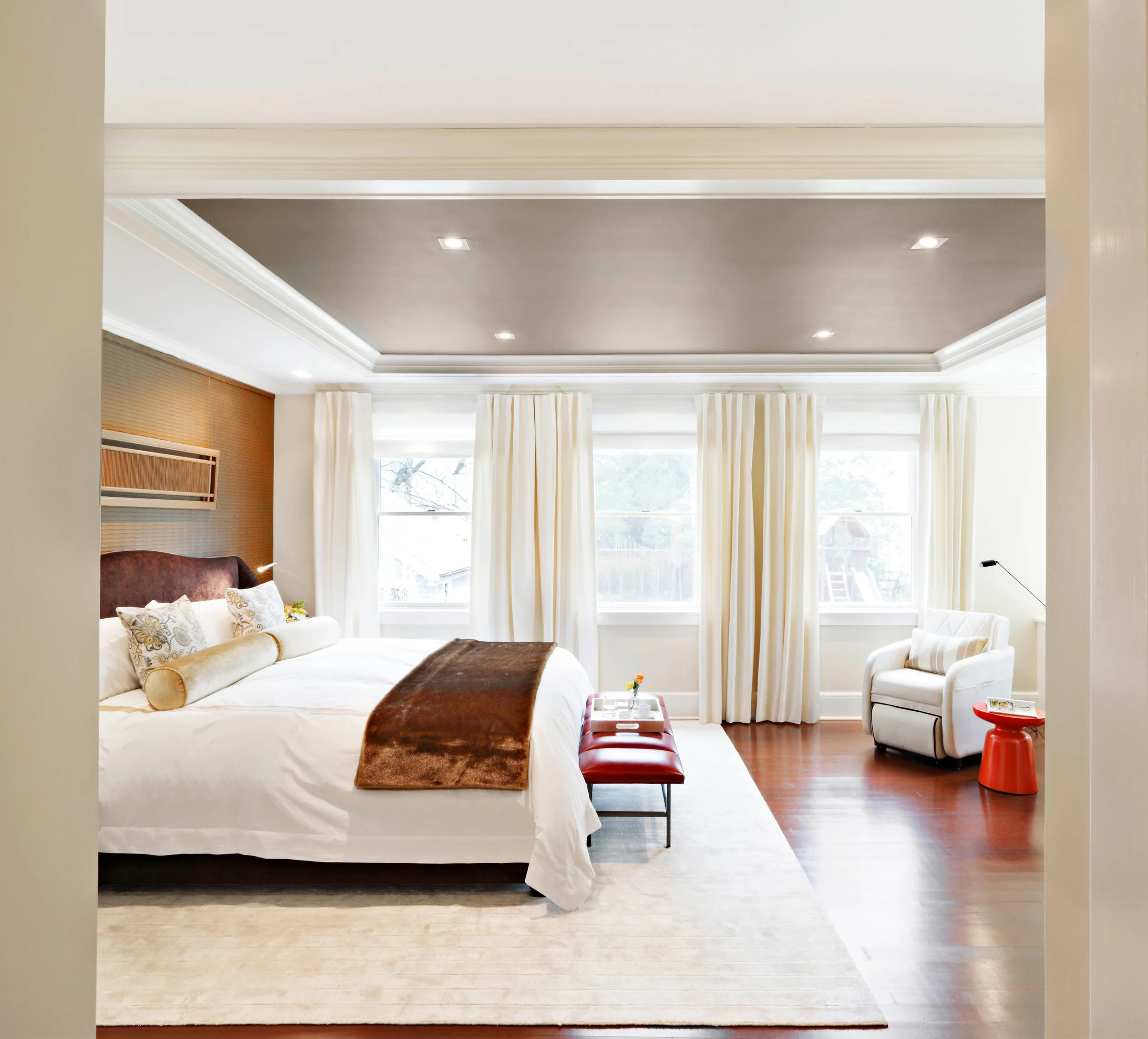 Primary bedroom in Indian Field residence in Greenwich, CT designed by Luminosus Designs with layered textiles and custom furnishing.