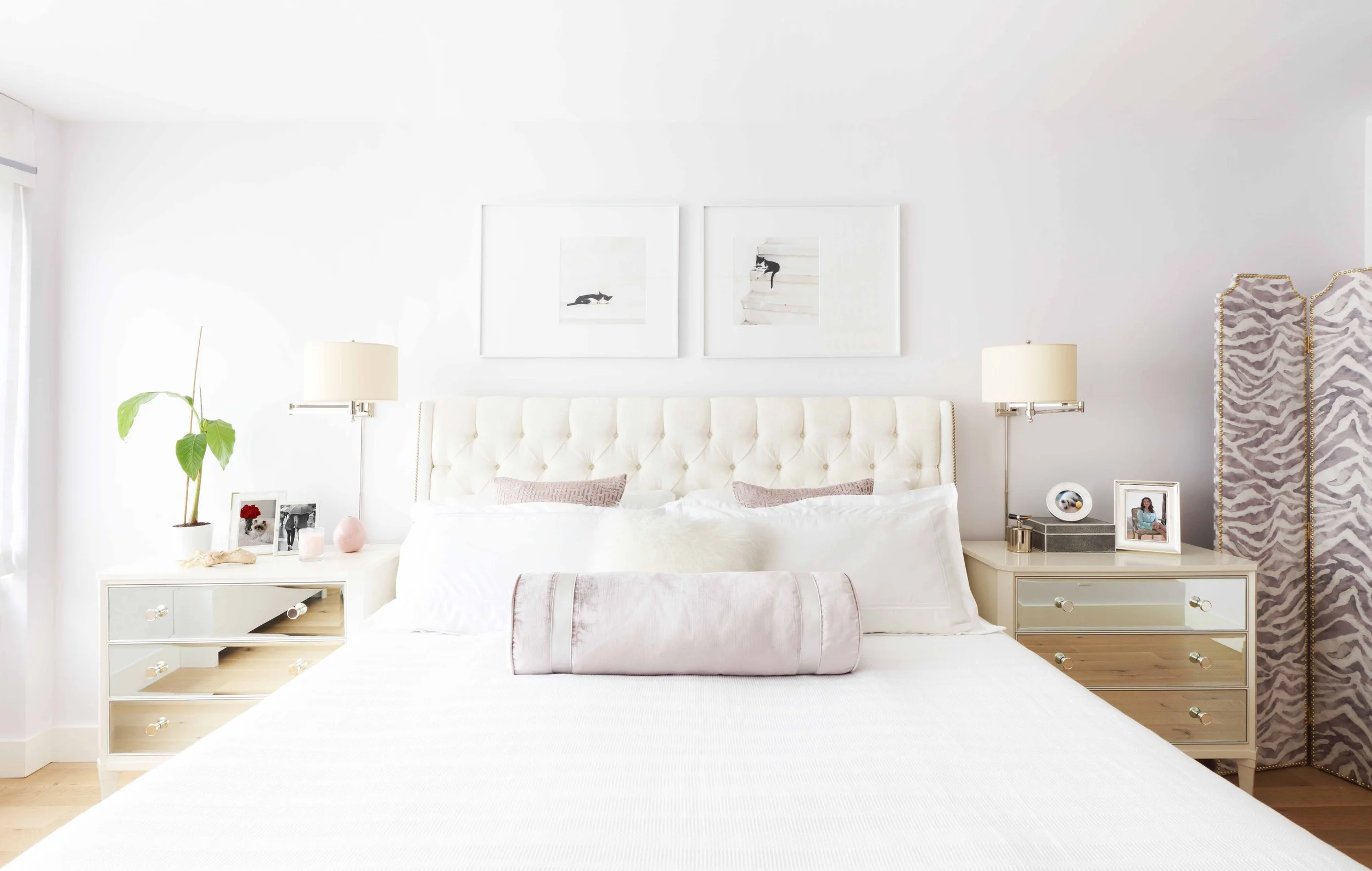 Primary bedroom with expansive window, light flooring, and refined furnishings in Doyer Apartment in White Plains, NY.