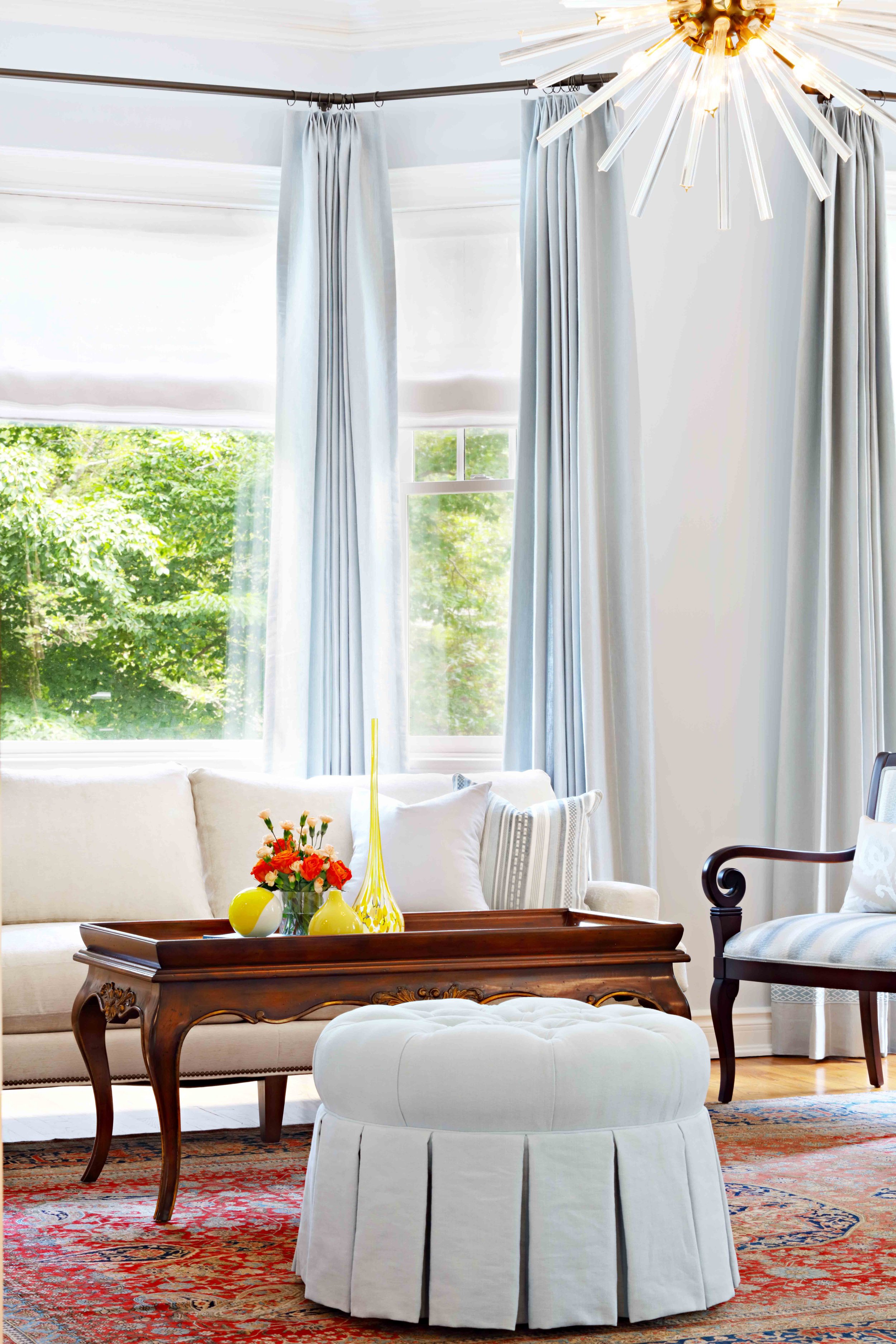 Living Room featuring fireplace and seating at Lismore House in Greenwich, Connecticut by Luminosus Designs.