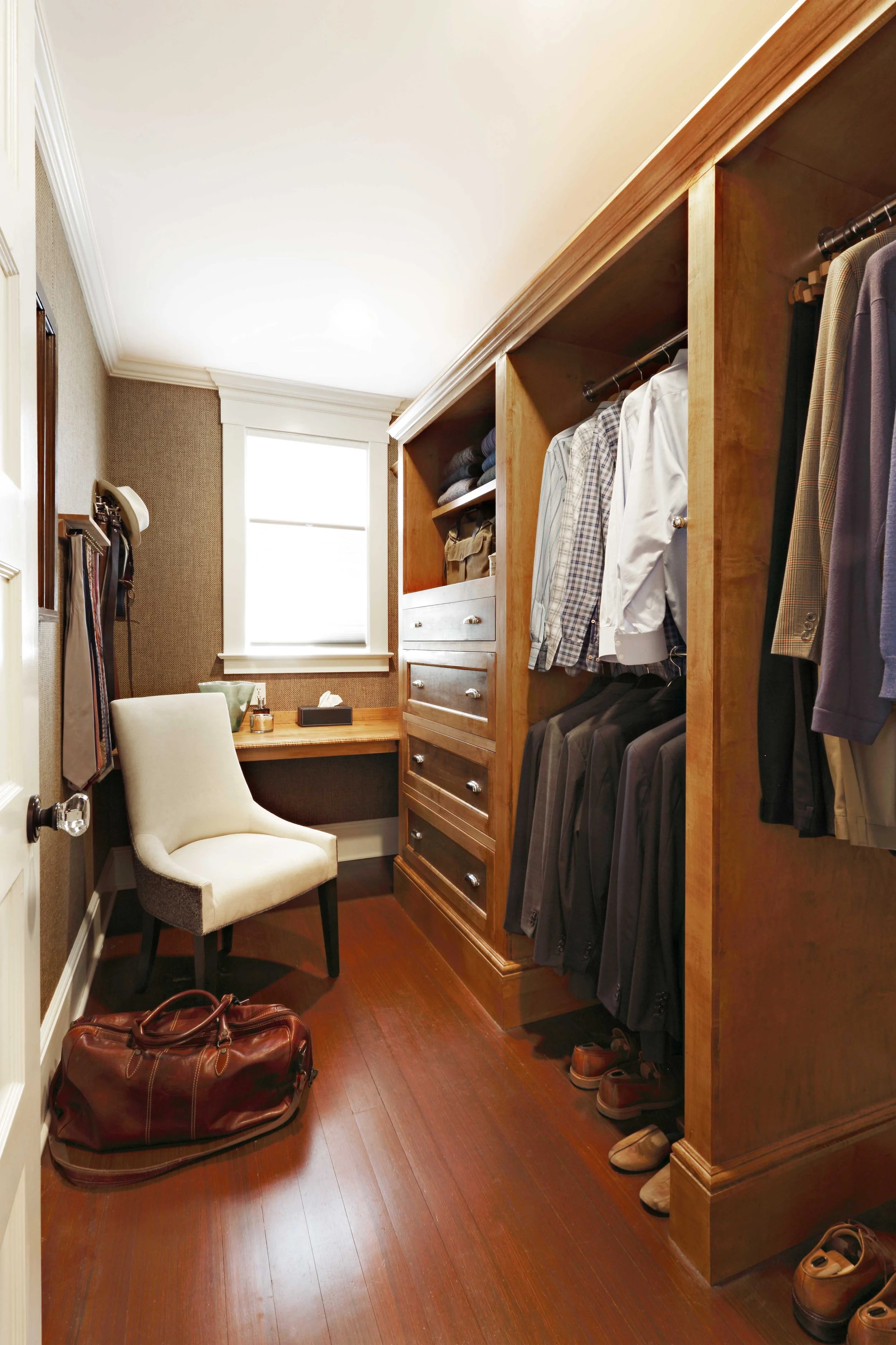 Custom his closet in Greenwich, CT designed by Luminosus Designs with tailored storage.