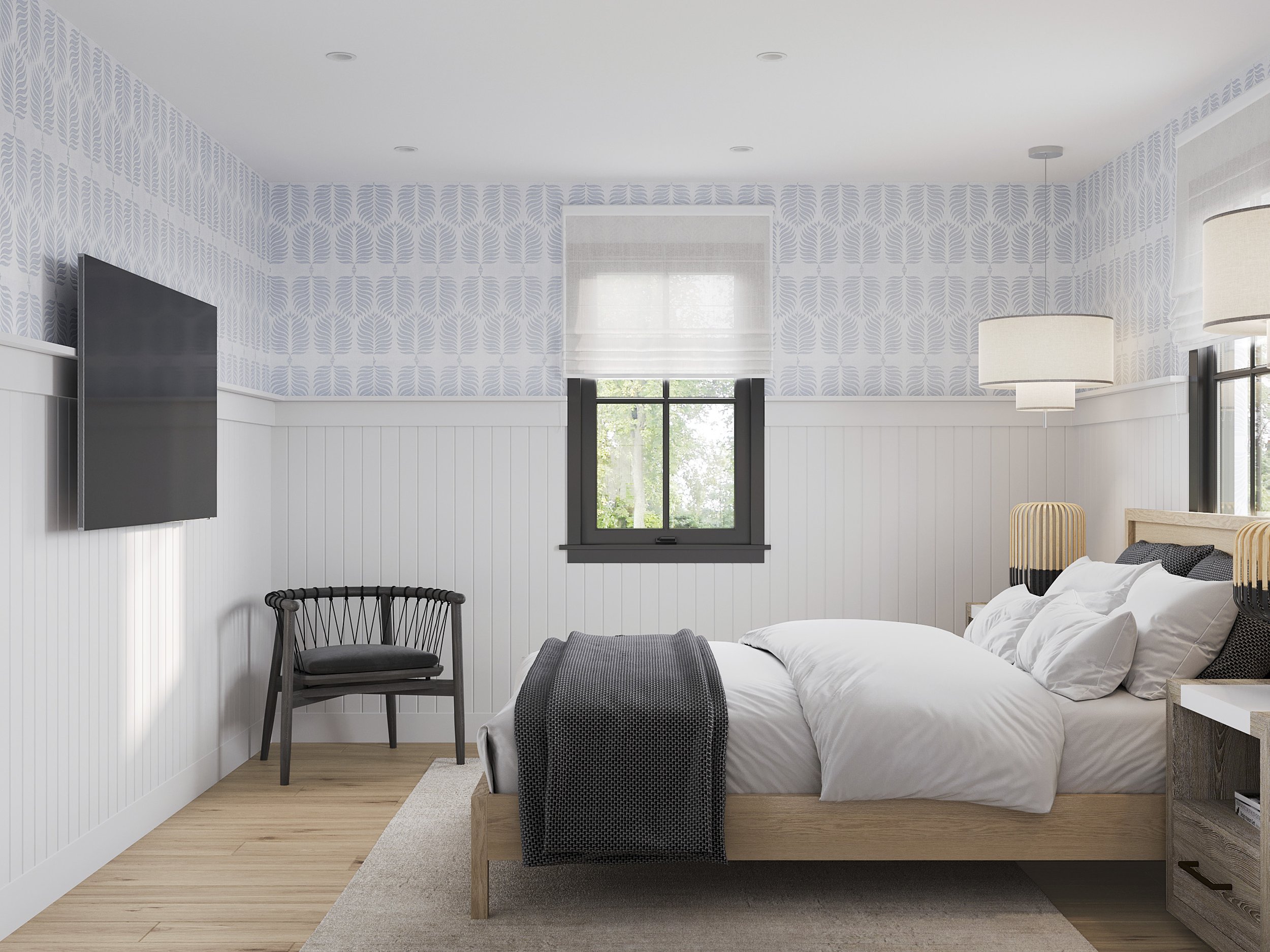 Wide view of guest bedroom with wall-mount TV and side chair in Nanny Hagen House in Thornwood, NY.