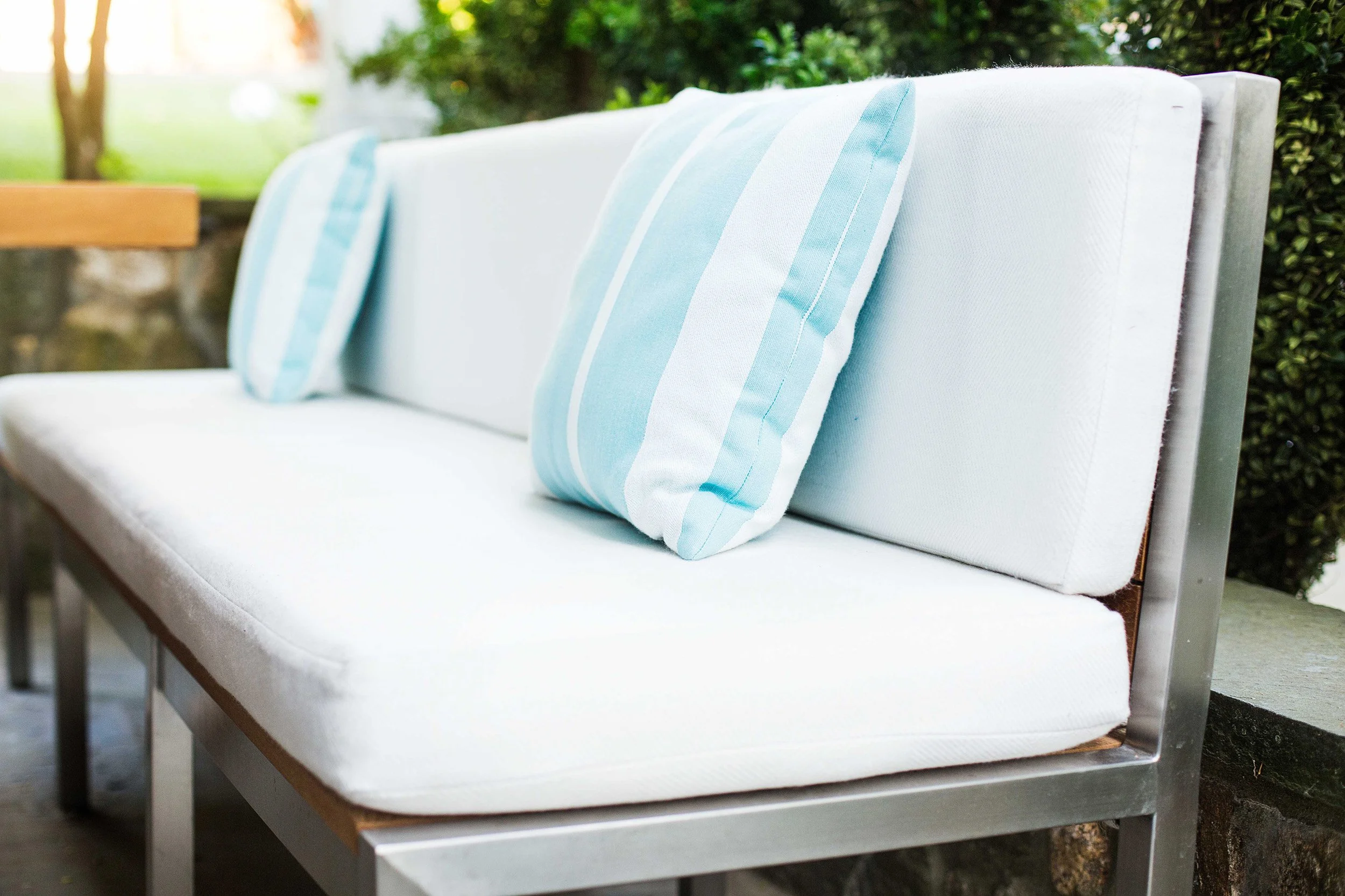 Close-up of custom dining bench in the outdoor seating at the Indian Field Outdoor project in Greenwich, CT.