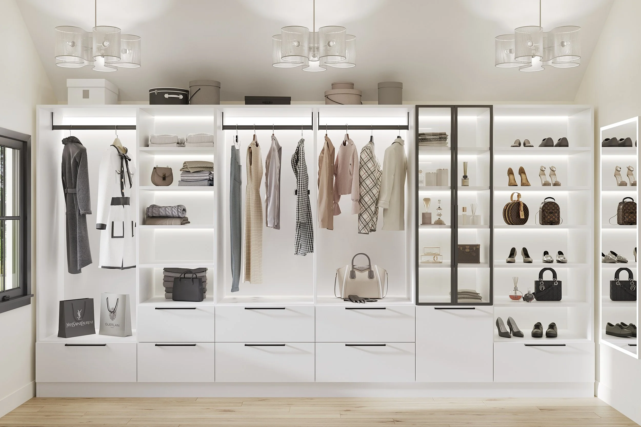 Custom walk-in primary closet in Nanny Hagen House in Thorwood, NY featuring layered lighting and custom cabinetry by Luminosus Designs.