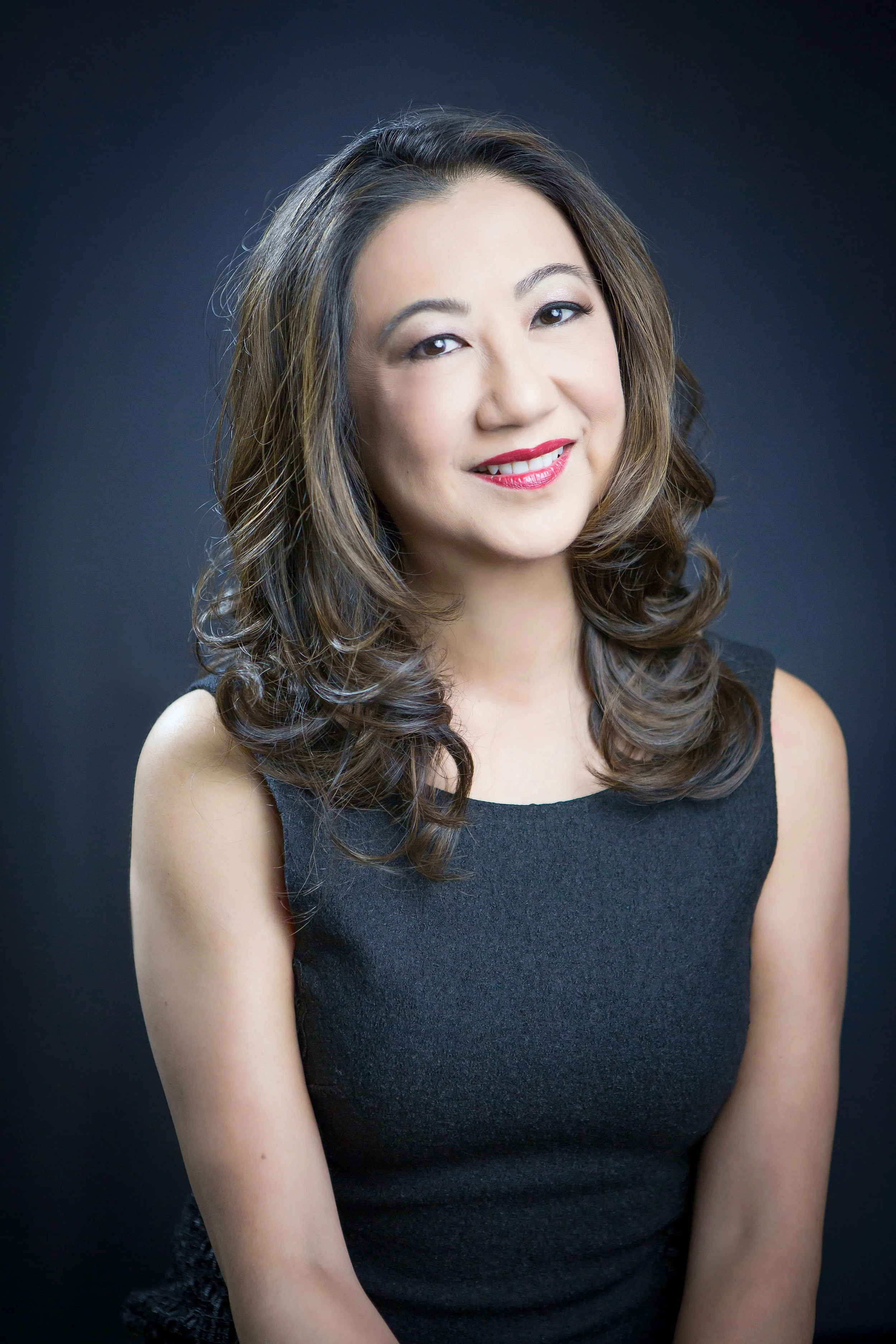 Mimi Fong headshot in black dress
