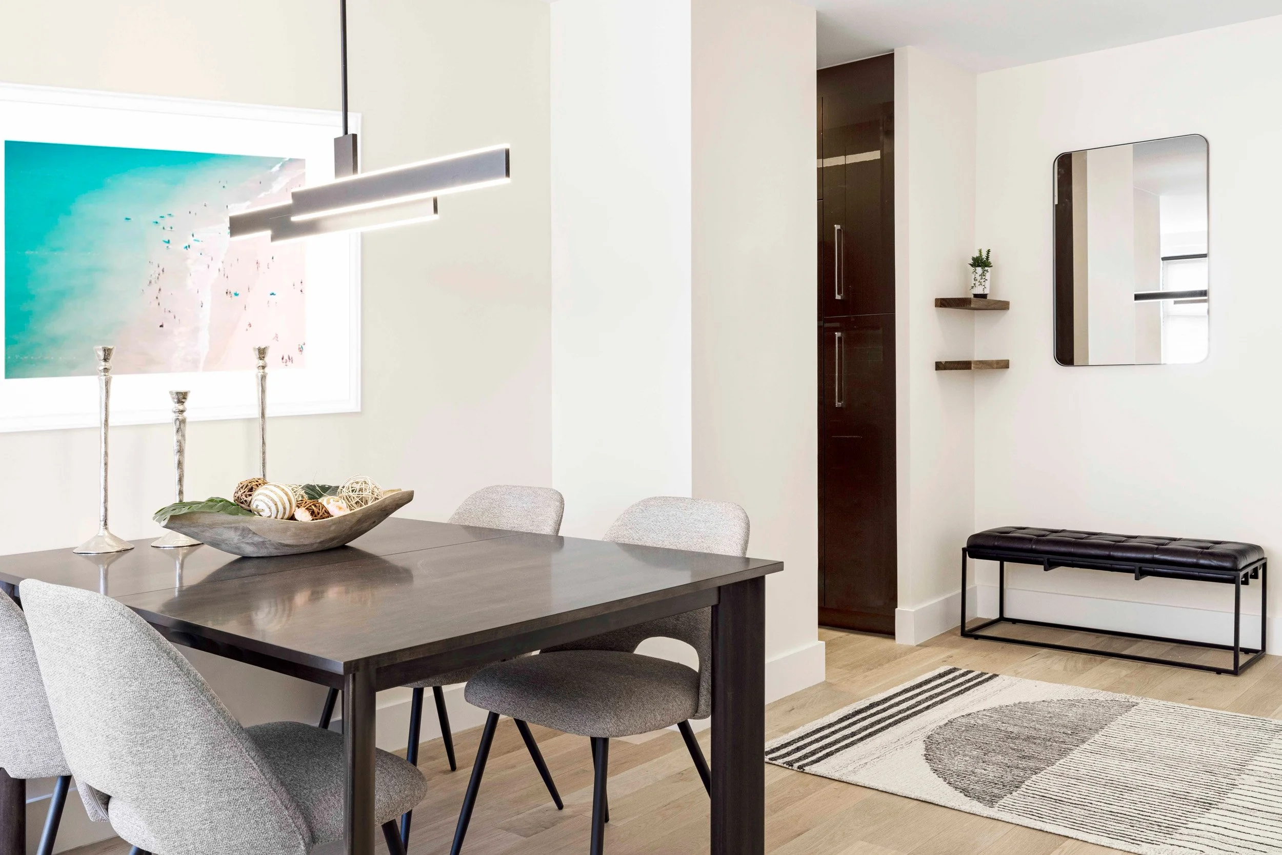 Wide view of the dining area looking into adjacent foyer and kitchen in the Gramercy Arms apartment NYC.