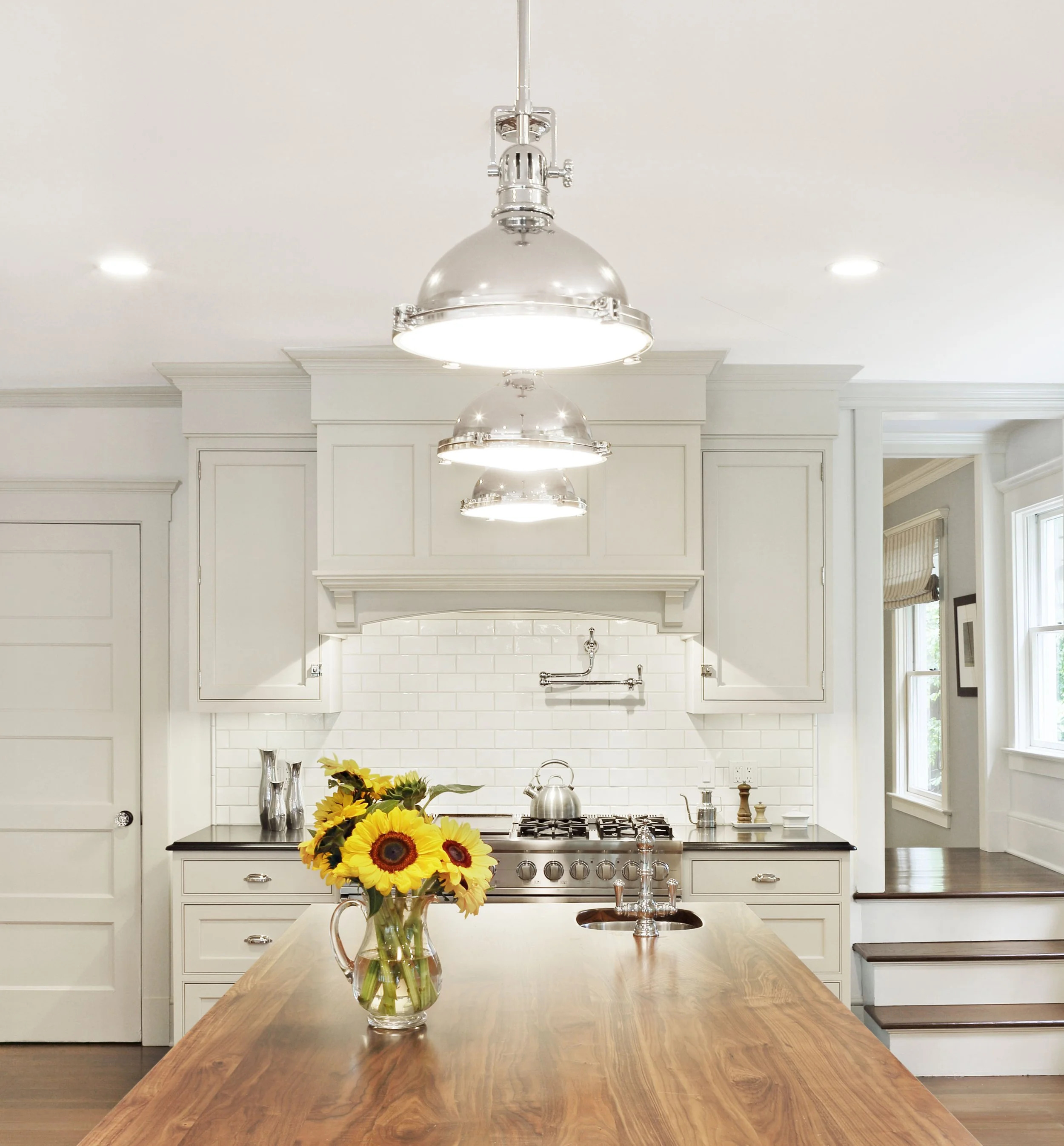 Island pendant lighting selected and installed by Luminosus Designs.