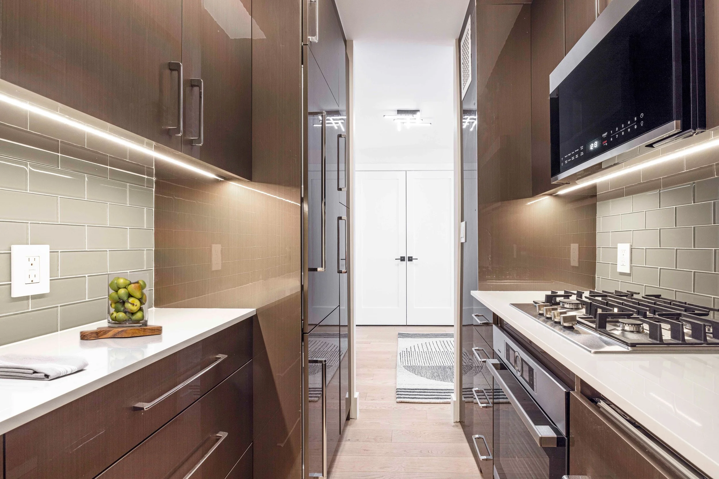 Wide view of the Gramercy Arms foyer in New York City, creating a welcoming first impression through proportion, lighting, and material choices.