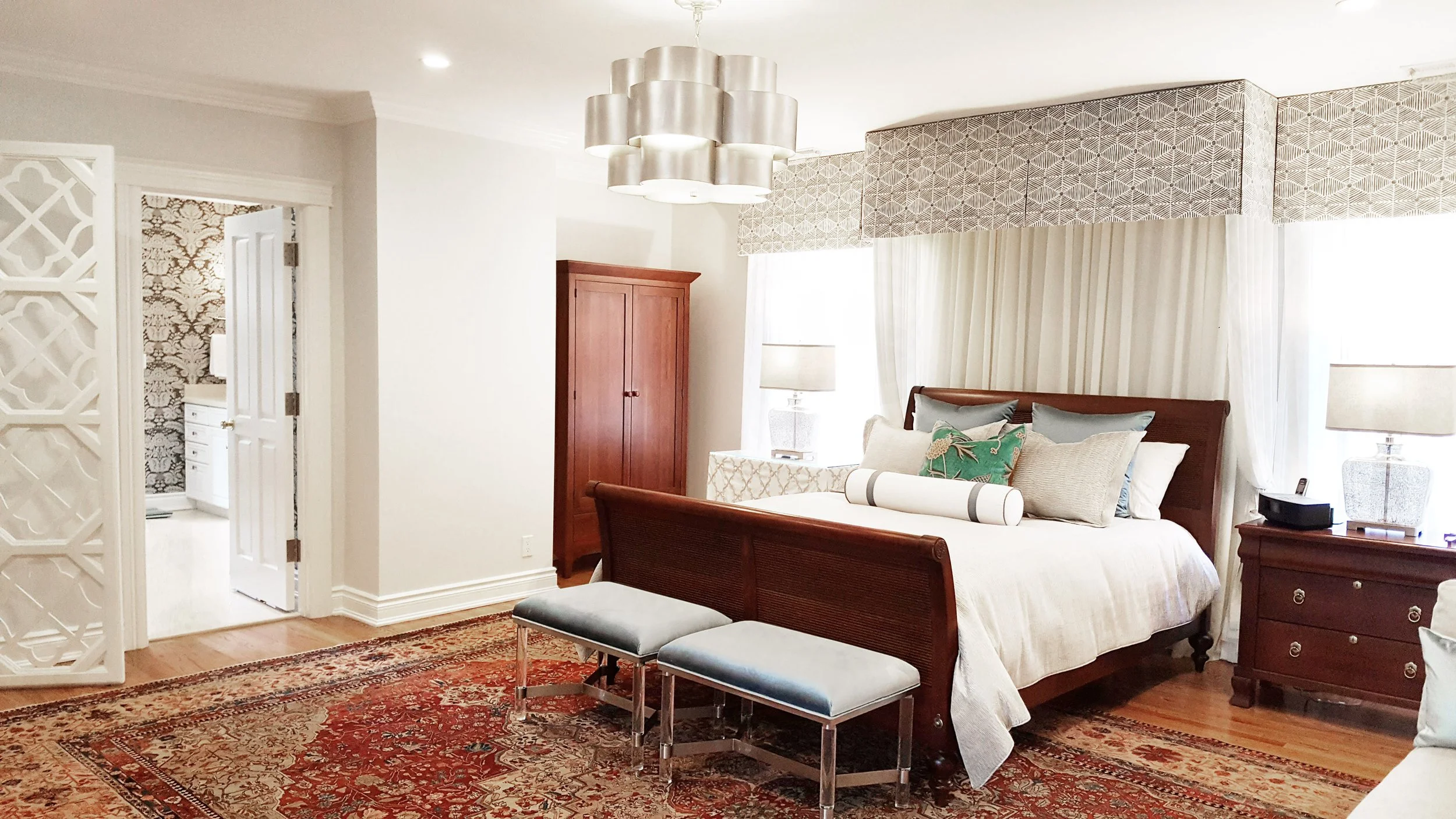 Primary Bedroom featuring upholstered bed with tailored bed canopy and bench at Lismore House in Greenwich, Connecticut by Luminosus Designs.