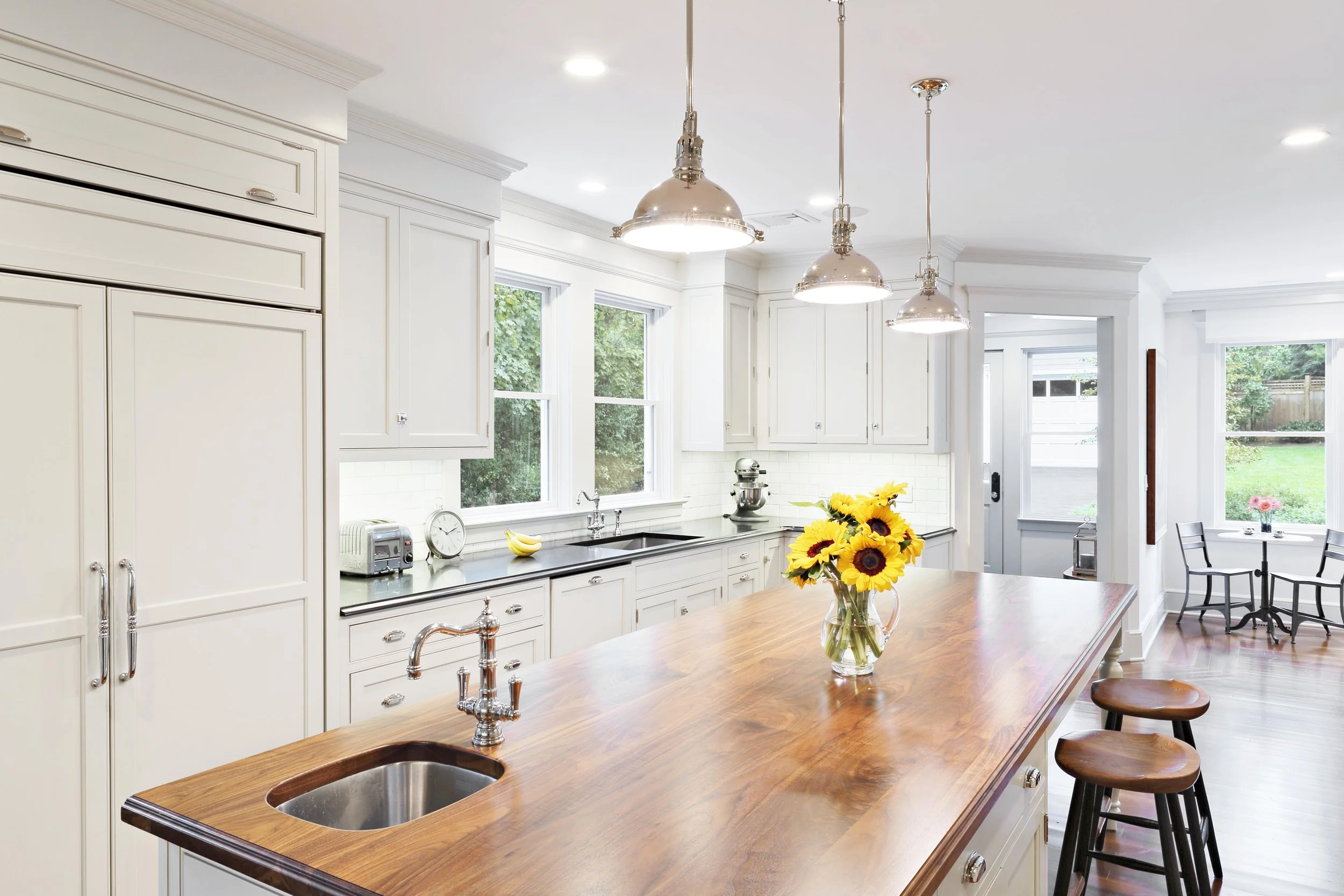 Wide kitchen view showcasing custom lighting work.