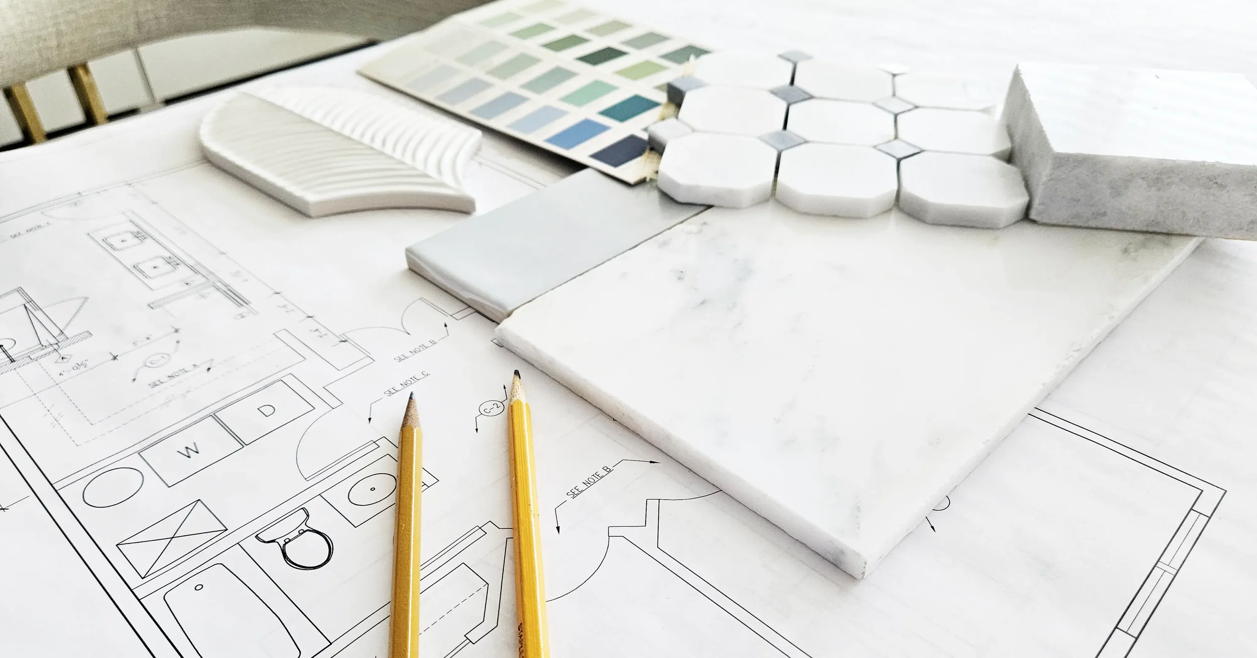 interior design renovation planning with floor plans and material samples