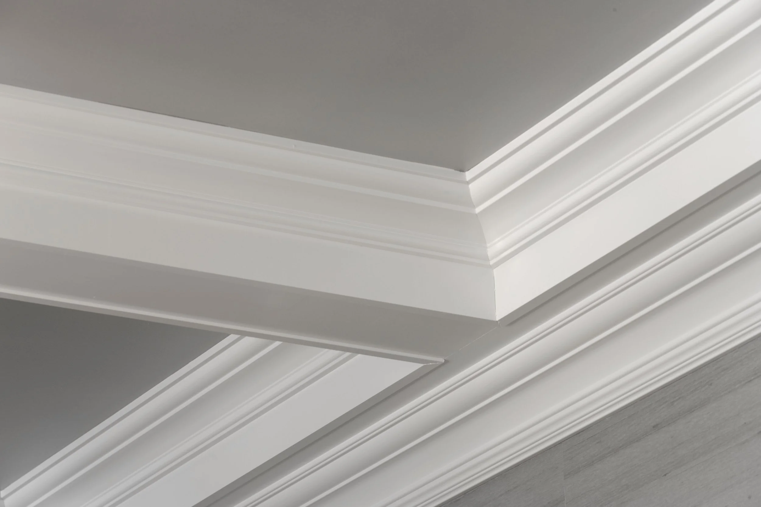 Coffered ceiling with silver leaf detail in Parkfield House in Scarsdale NY dining room.