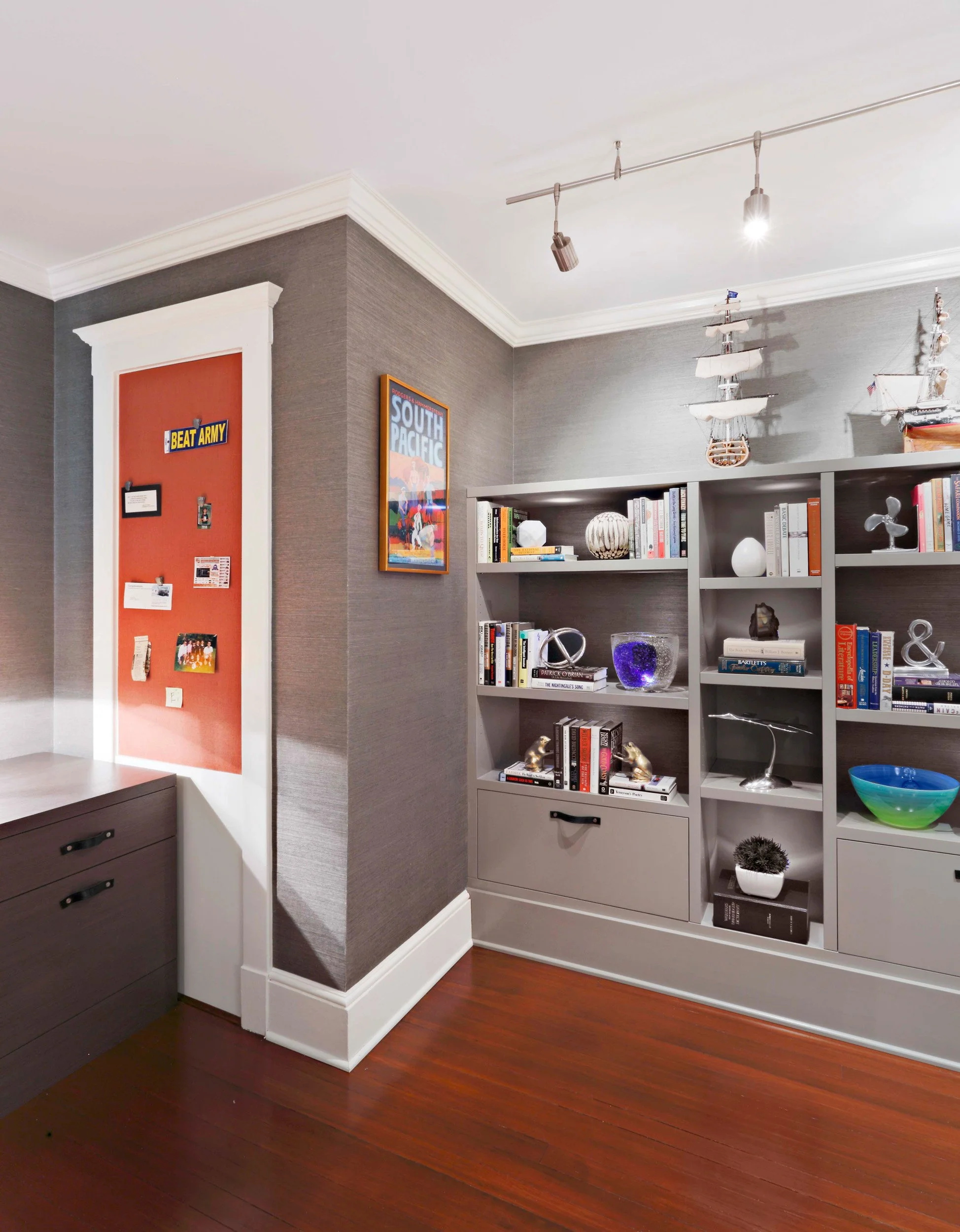 Custom bookcase and pin-up board integrated into home office wall in home office in Indian Field residence in Greenwich, CT.