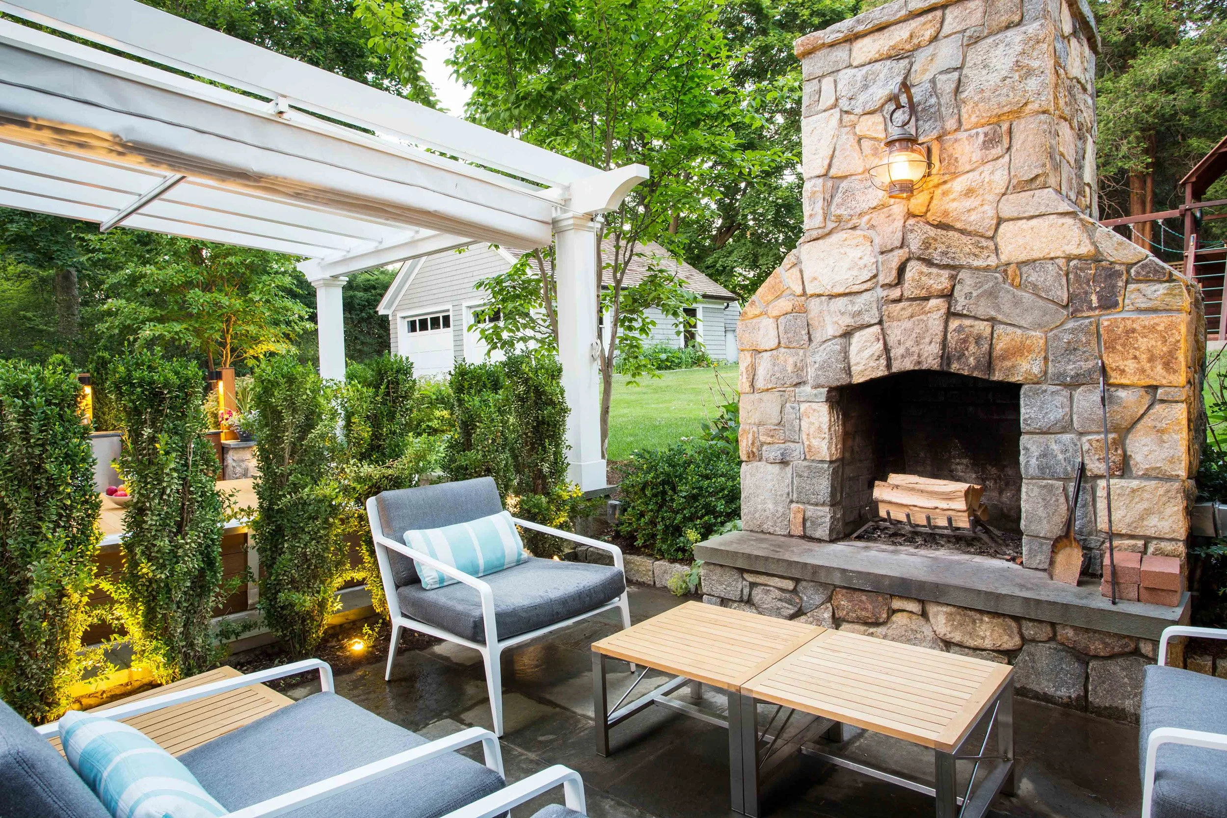 Wide view of outdoor lounge furniture at the Indian Field Outdoor project in Greenwich, CT, designed by Luminosus Designs.