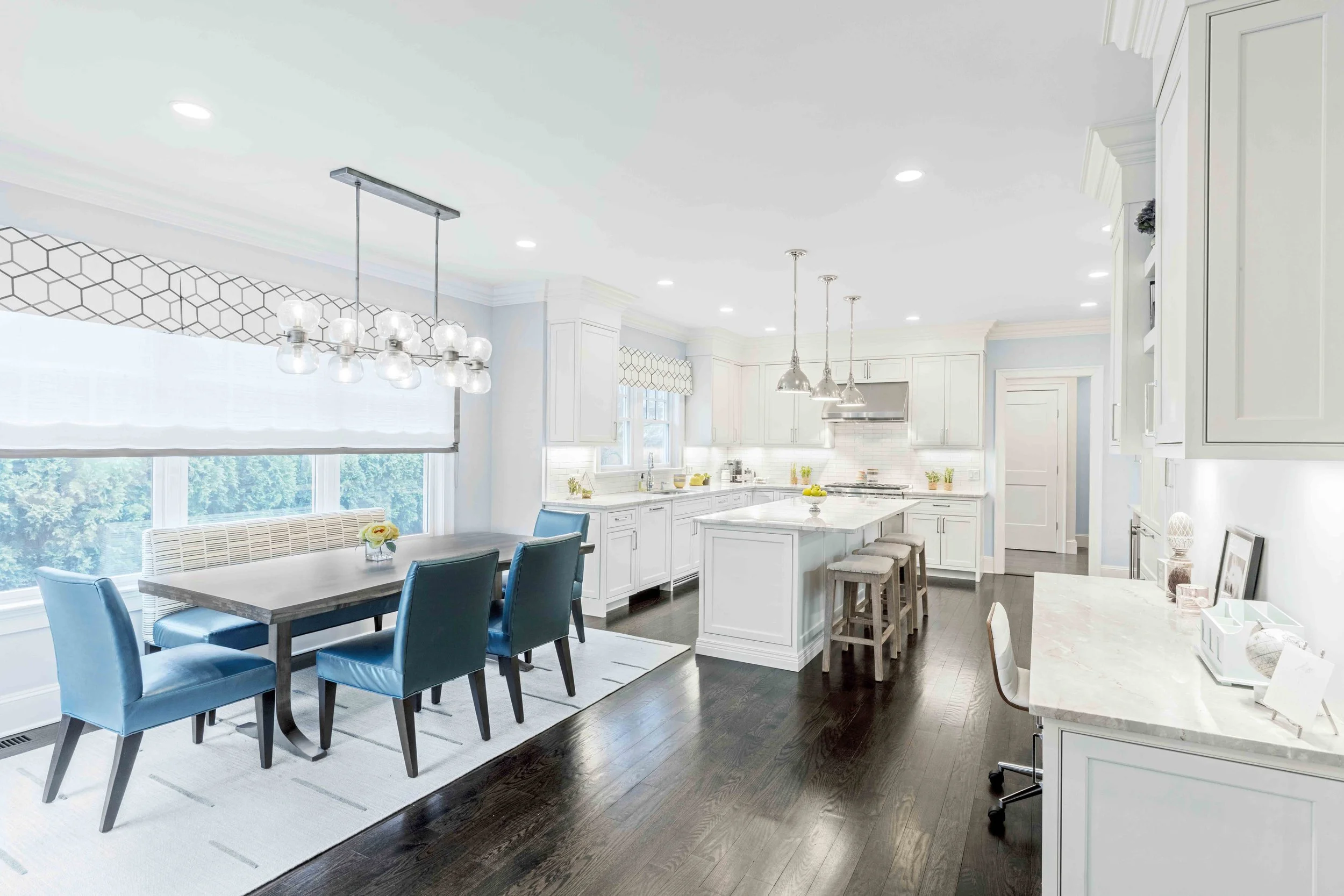 Wide view of the breakfast area and kitchen in the Glen Oaks home in Rye, NY.