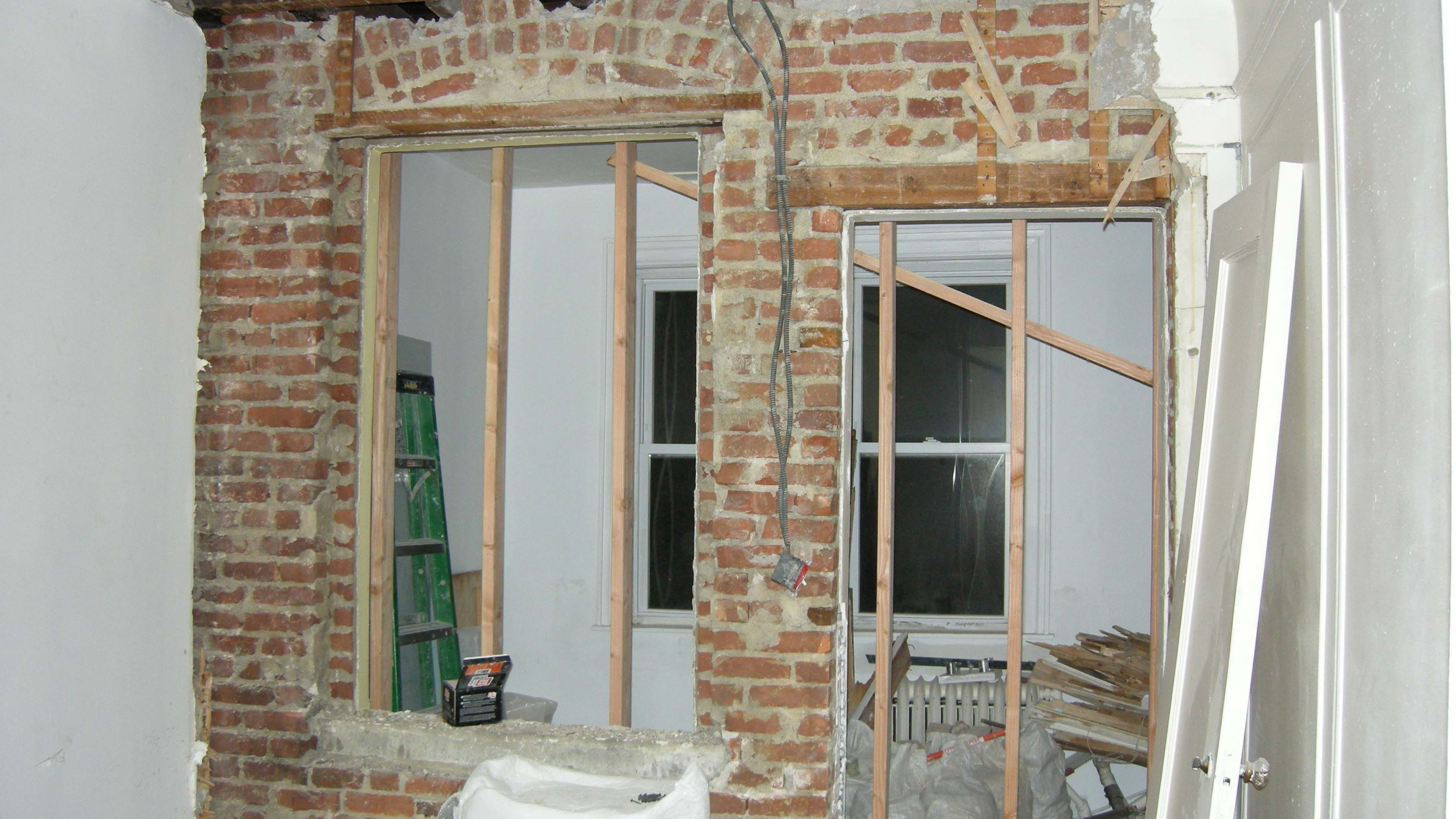 Exposed interior wall and hidden conditions discovered during renovation of an early 1900s home
