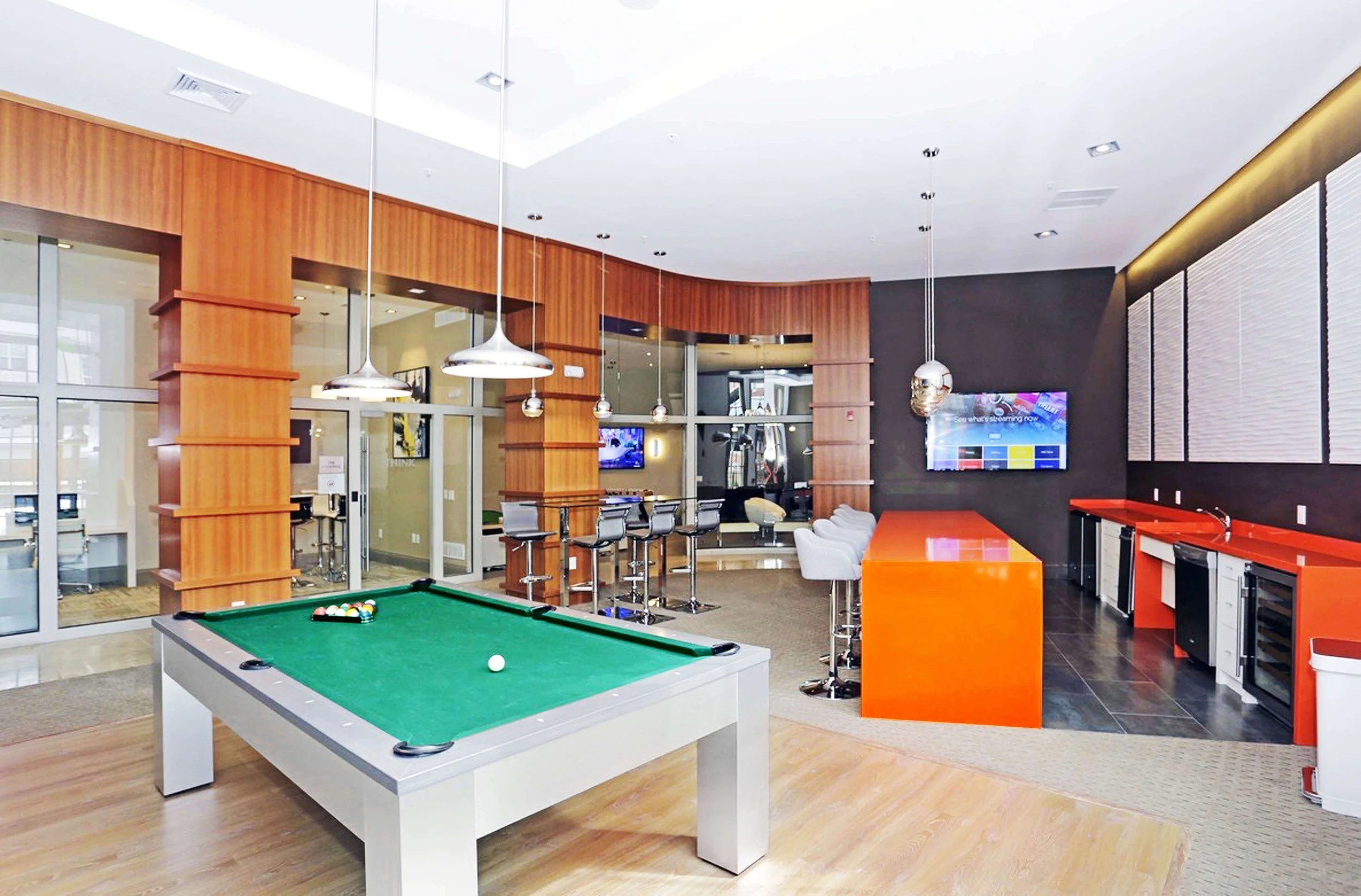 Apartment lounge design in Bayonne NJ with seating areas and open layout for shared residential use.