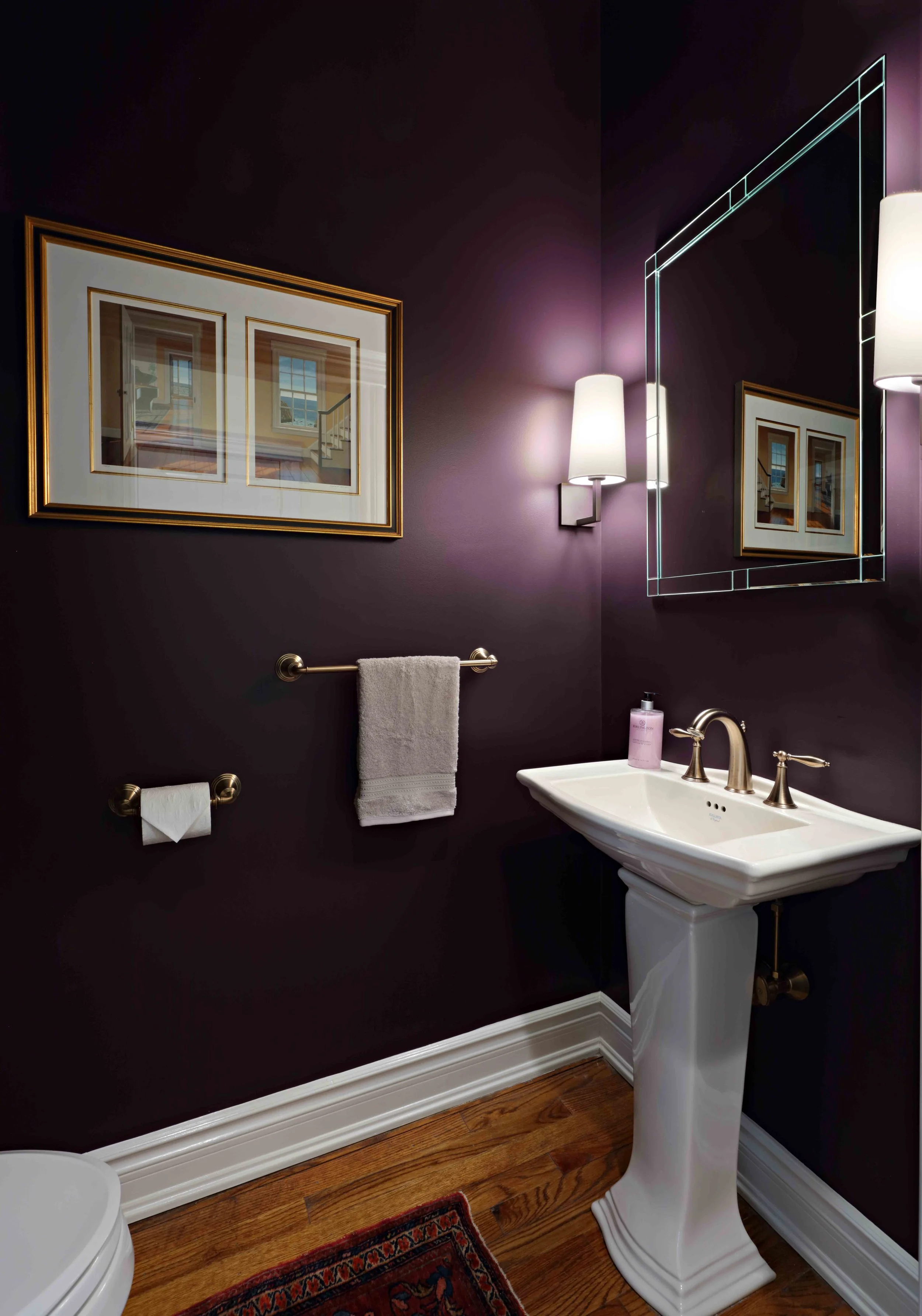 Powder Room featuring pedestal sink and wall color at Lismore House in Greenwich, Connecticut by Luminosus Designs.
