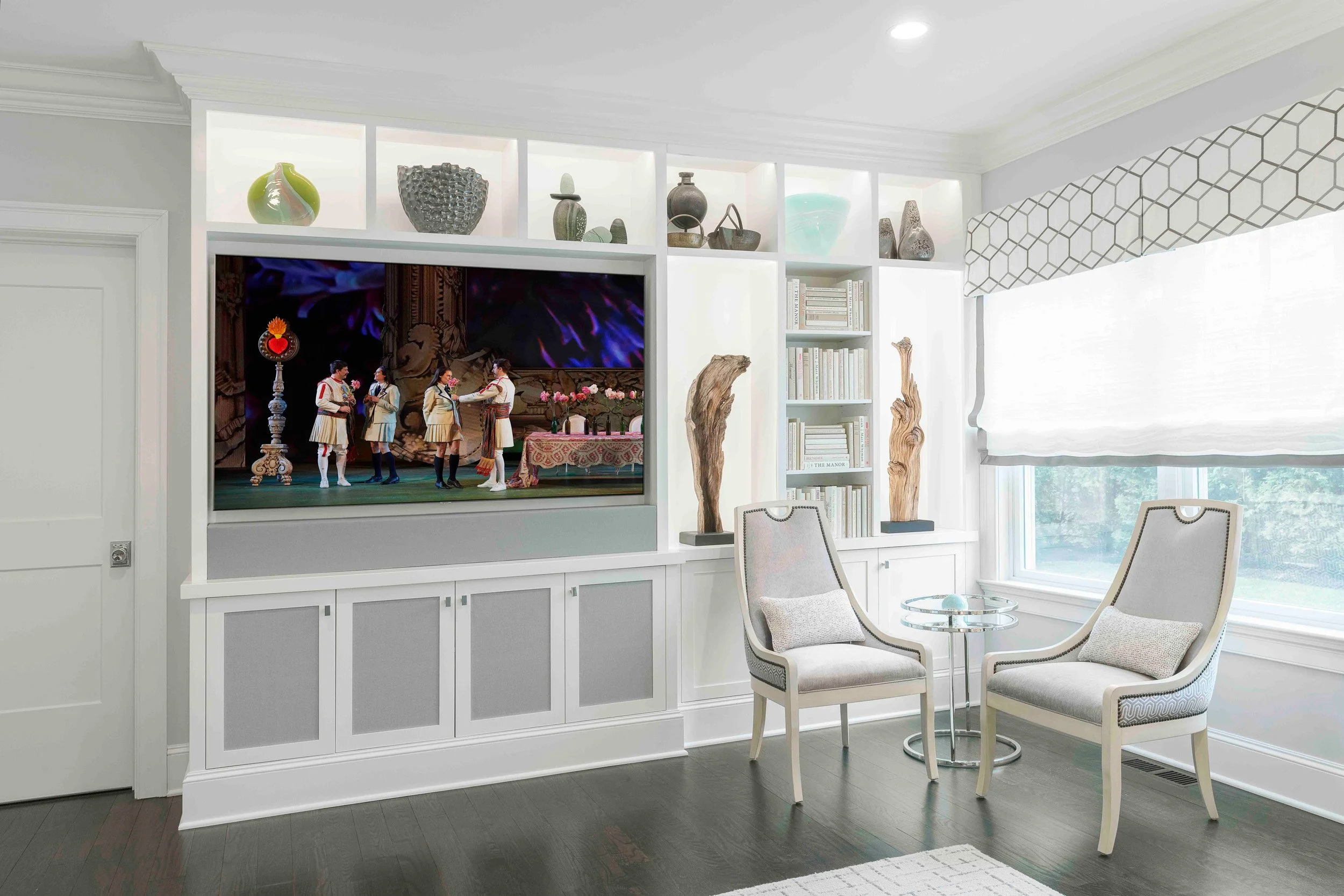 Close-up view of the media cabinet, and guest chairs in the Glen Oaks family room in Rye NY.