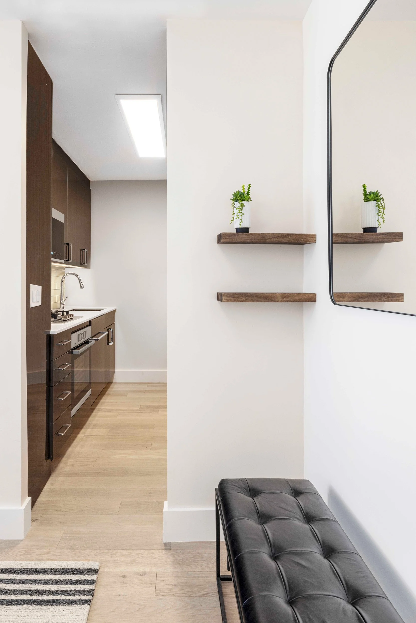 Wide view of the Gramercy Arms foyer in New York City, creating a welcoming first impression through proportion, lighting, and material choices.