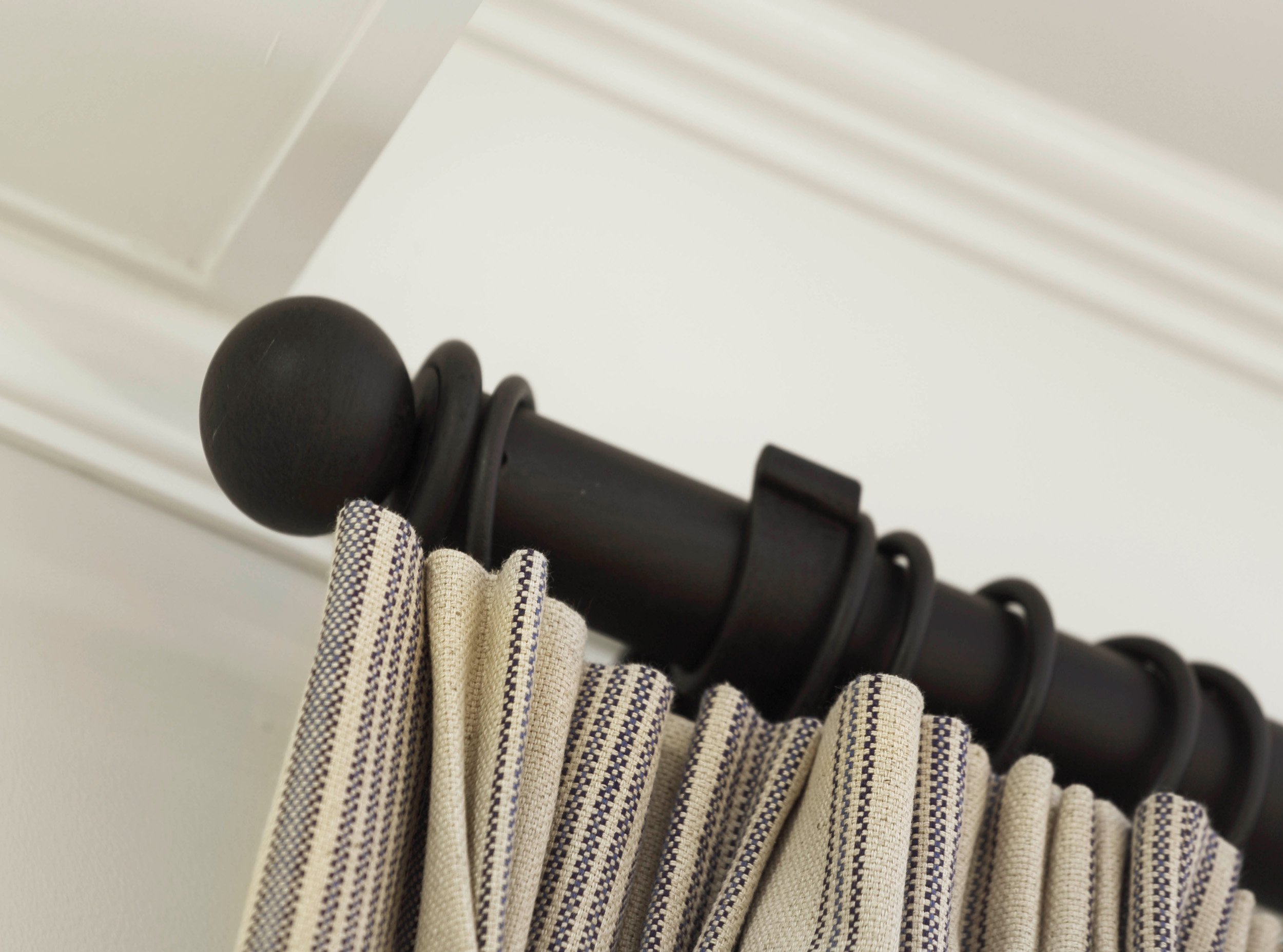 Custom drapery detail framing dining room windows in Indian Field residence in Greenwich, CT.