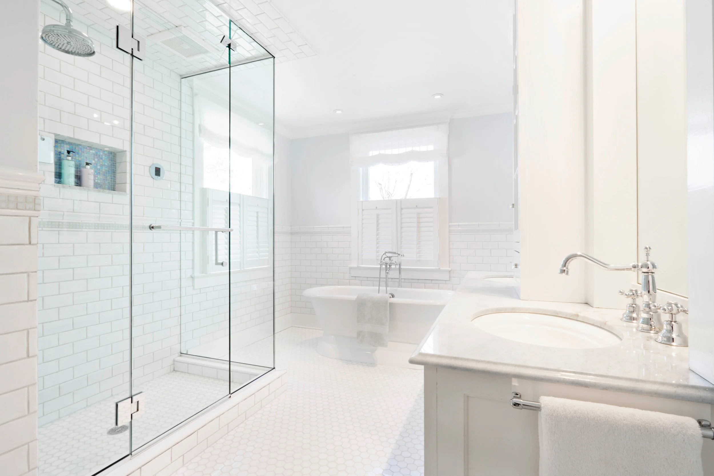 Alternative wide view of primary bathroom in Greenwich, CT designed by Luminosus Designs.