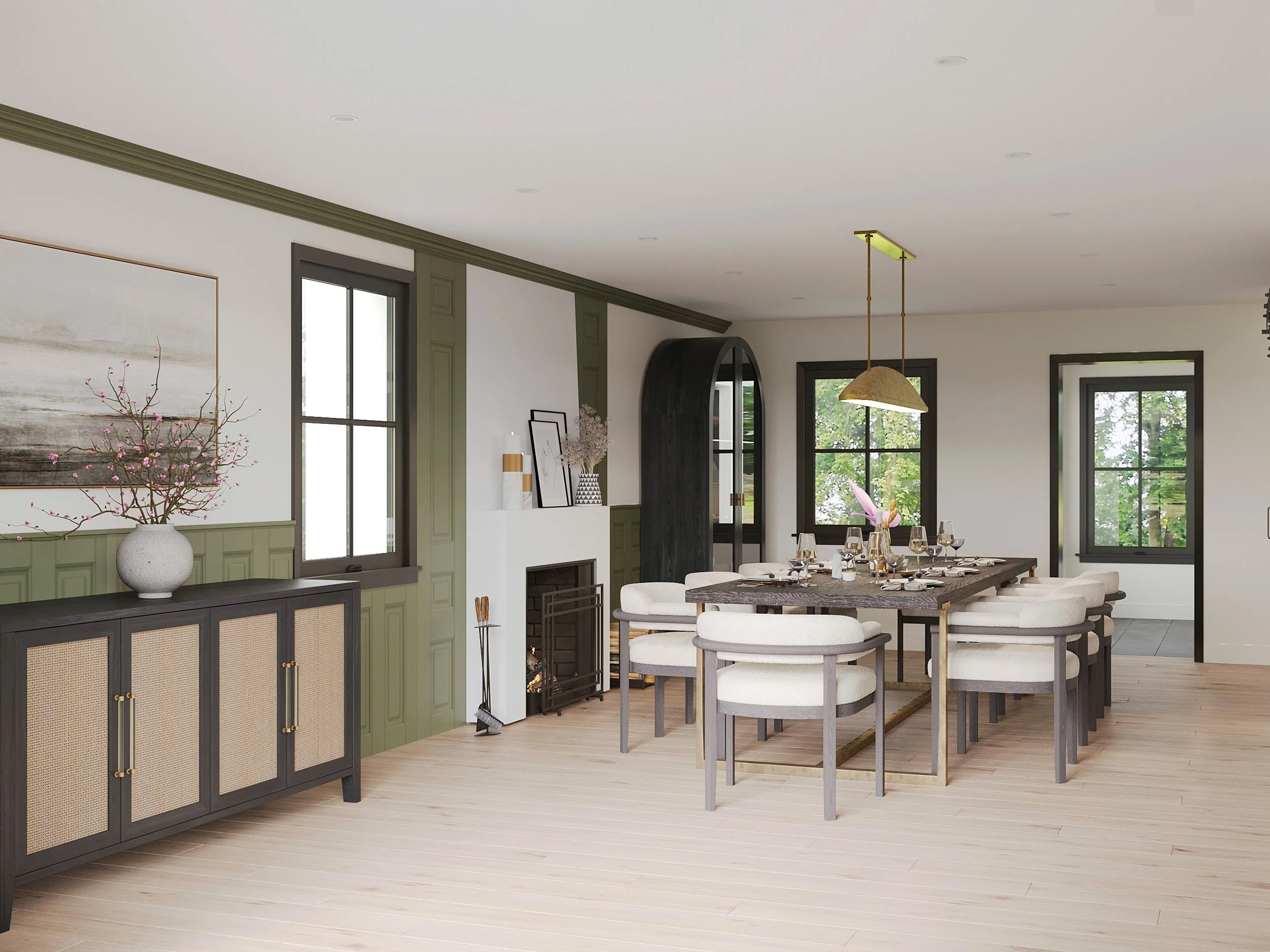 Wide view of dining room featuring brass accented dining table and chandelier in Nanny Hagen House in Thornwood, NY.
