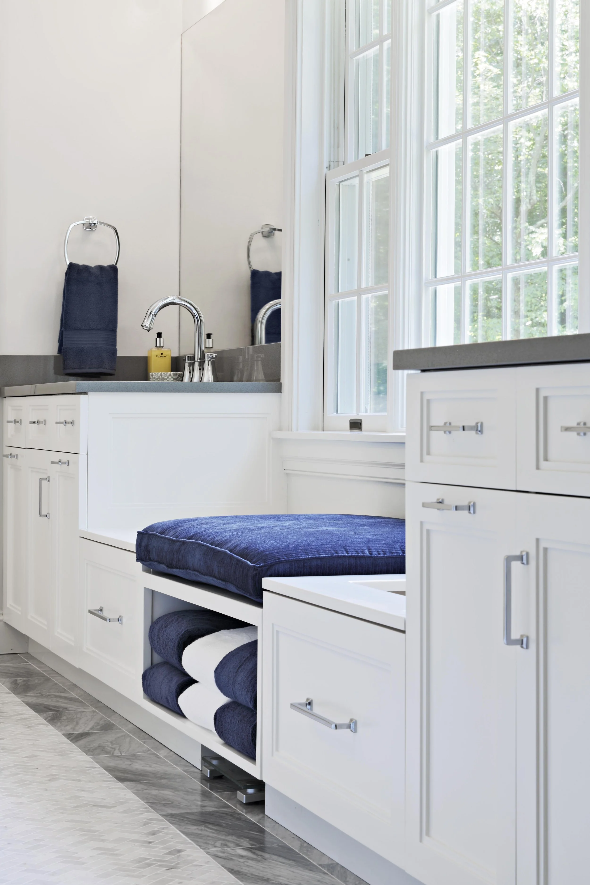 Close-up of a custom built-in bench beneath the window in a Jack and Jack bathroom at the Dann Farm residence in Pound Ridge, NY.