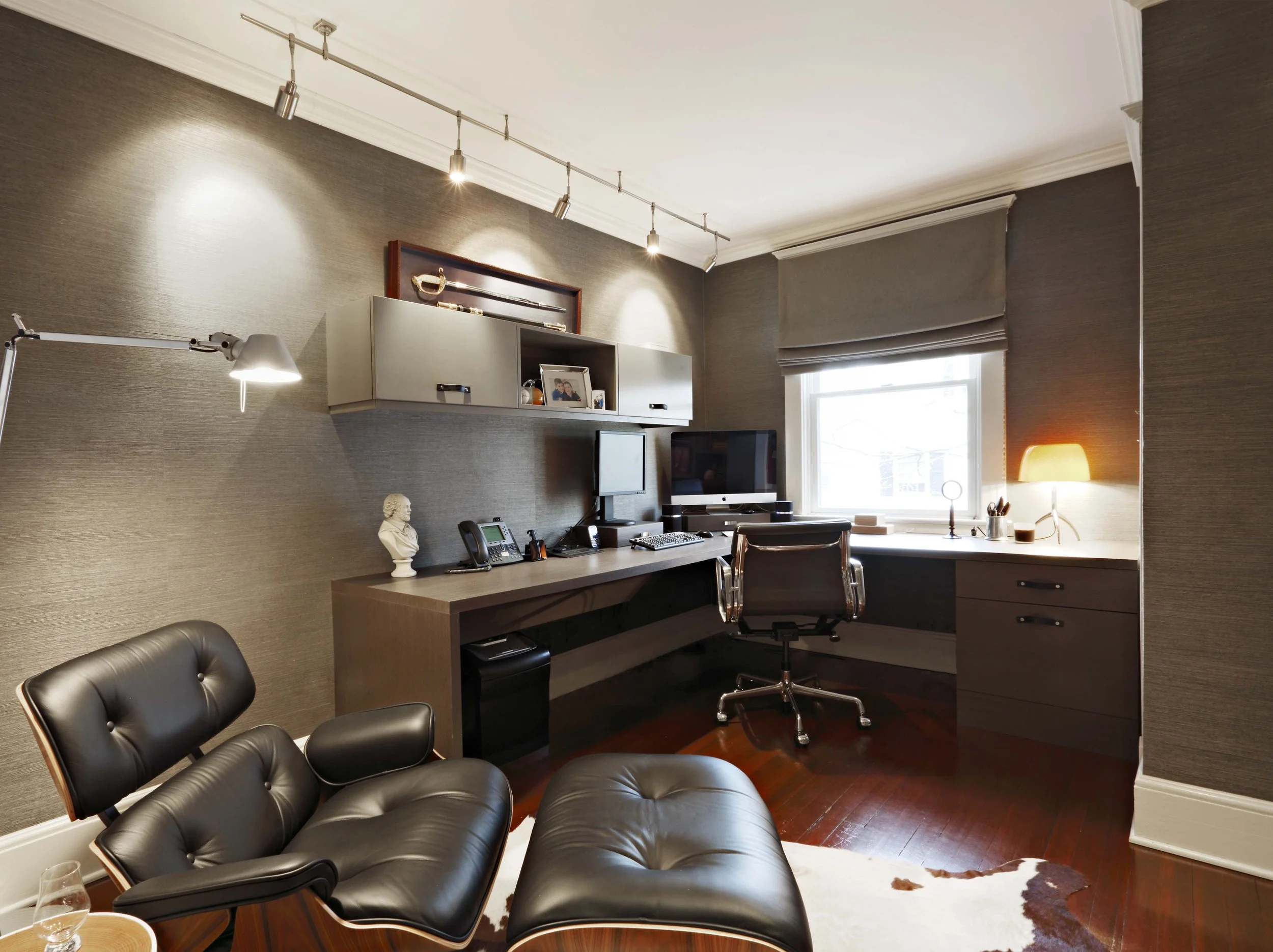 Home office in Greenwich, CT designed by Luminosus Designs with custom millwork and seating.