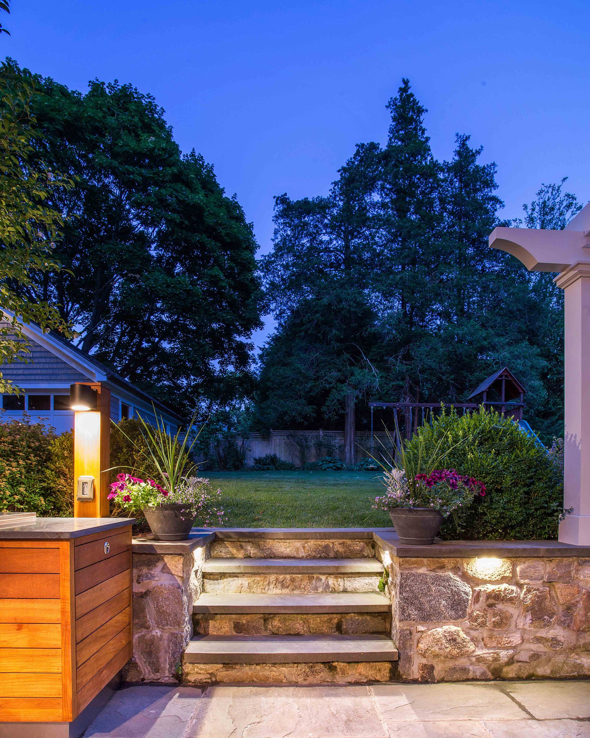 Detail of stone wall and steps in the outdoor patio at the Indian Field Outdoor project in Greenwich, CT.