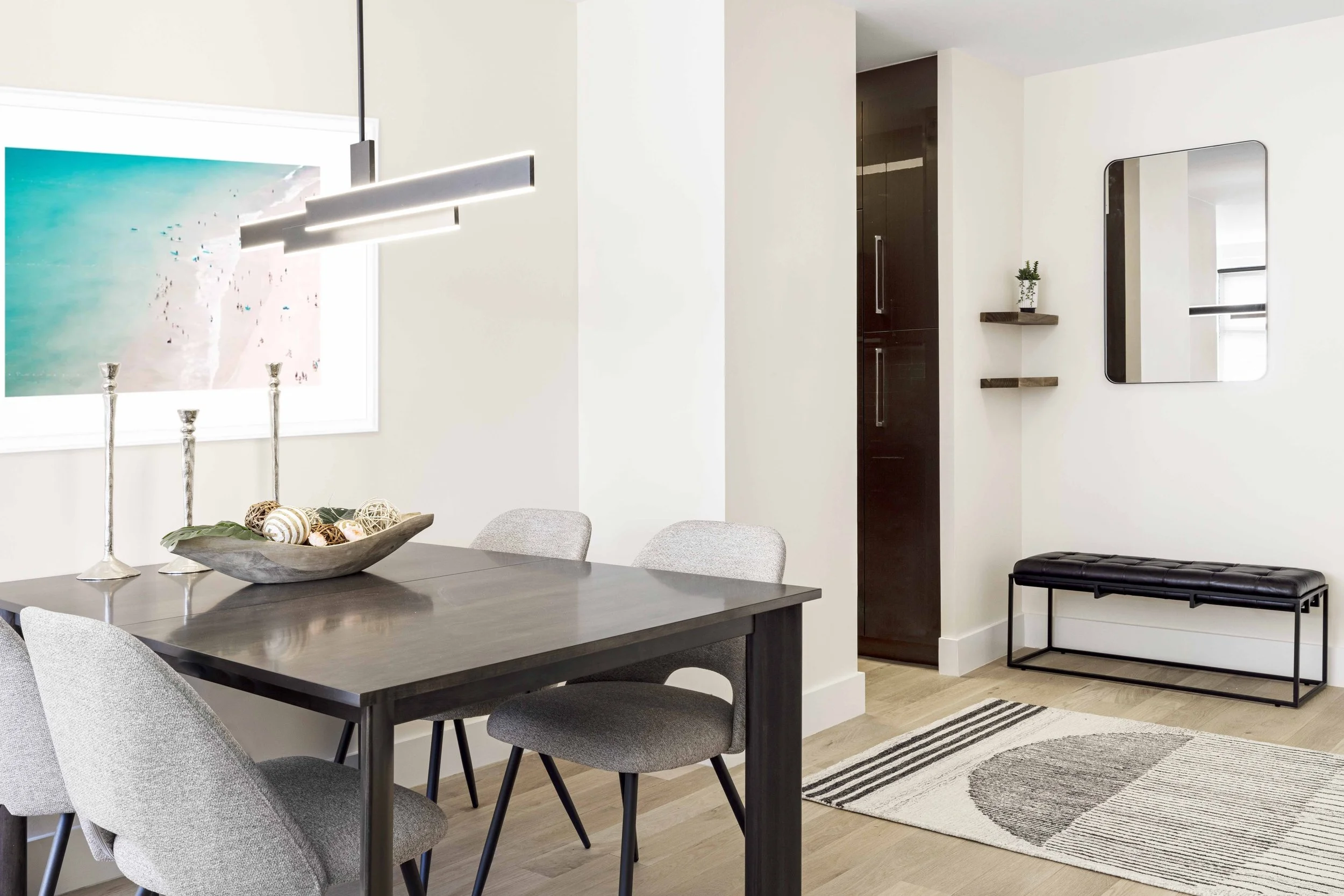 Wide view of the dining area looking into adjacent foyer and kitchen in the Gramercy Arms apartment NYC.