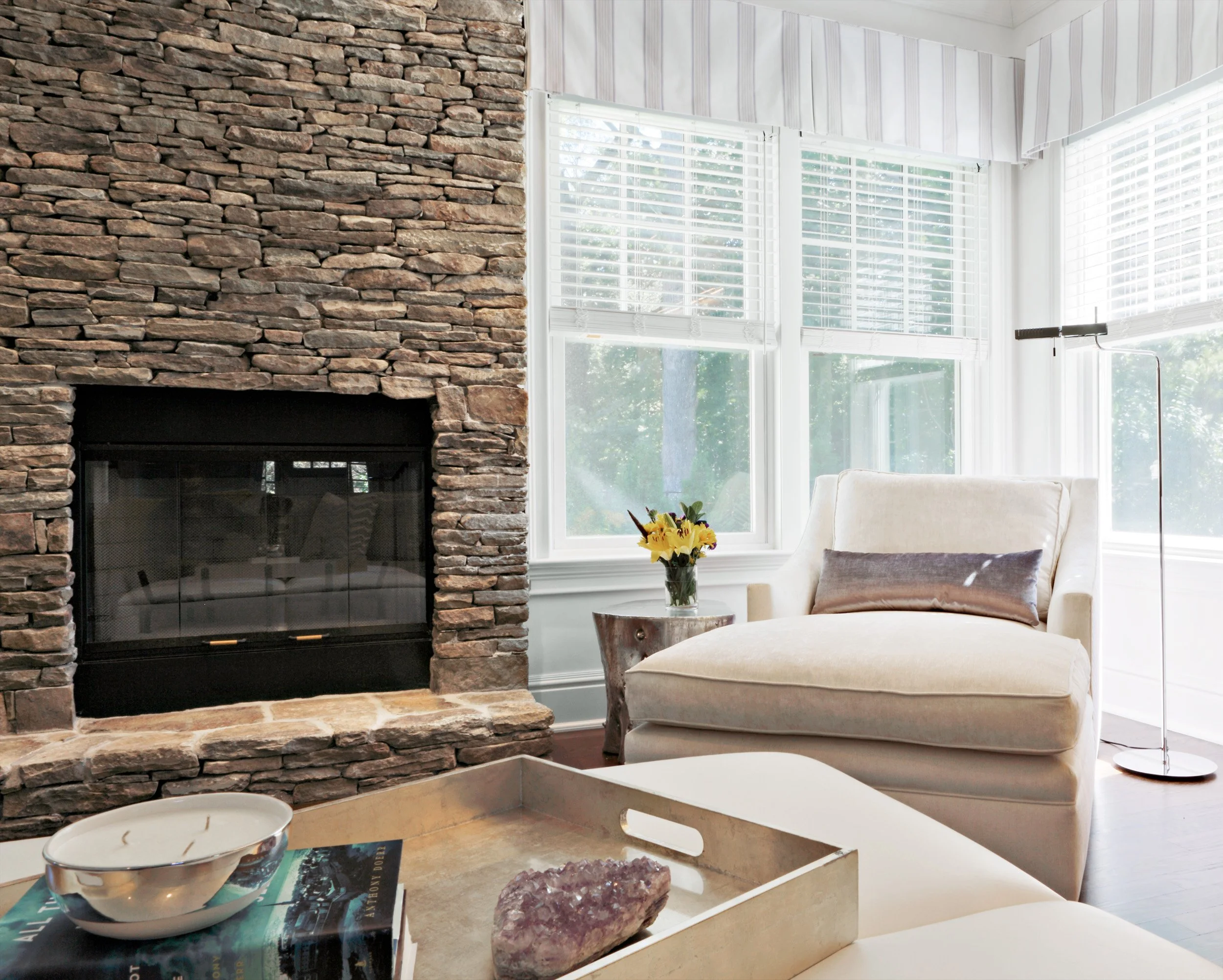Stone fireplace and chaise detail in Parkfield House in Scarsdale NY family room