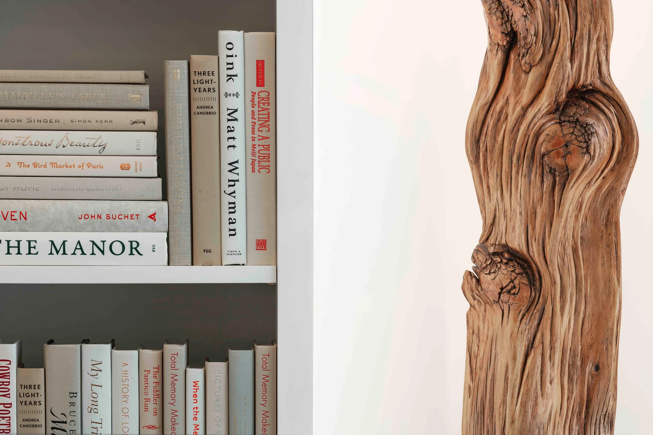 Detail view of styling and custom decoration in the media cabinet in the Glen Oaks, Rye NY family room, emphasizing texture and finish.