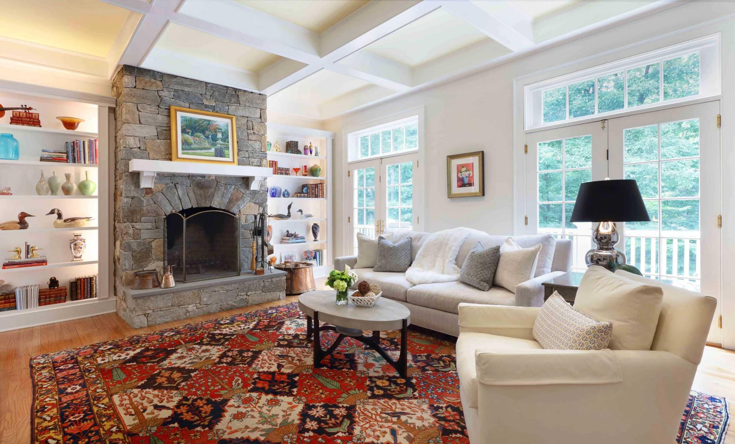 Family Room featuring seating arrangement and rug at Lismore House in Greenwich, CT by Luminosus Designs.