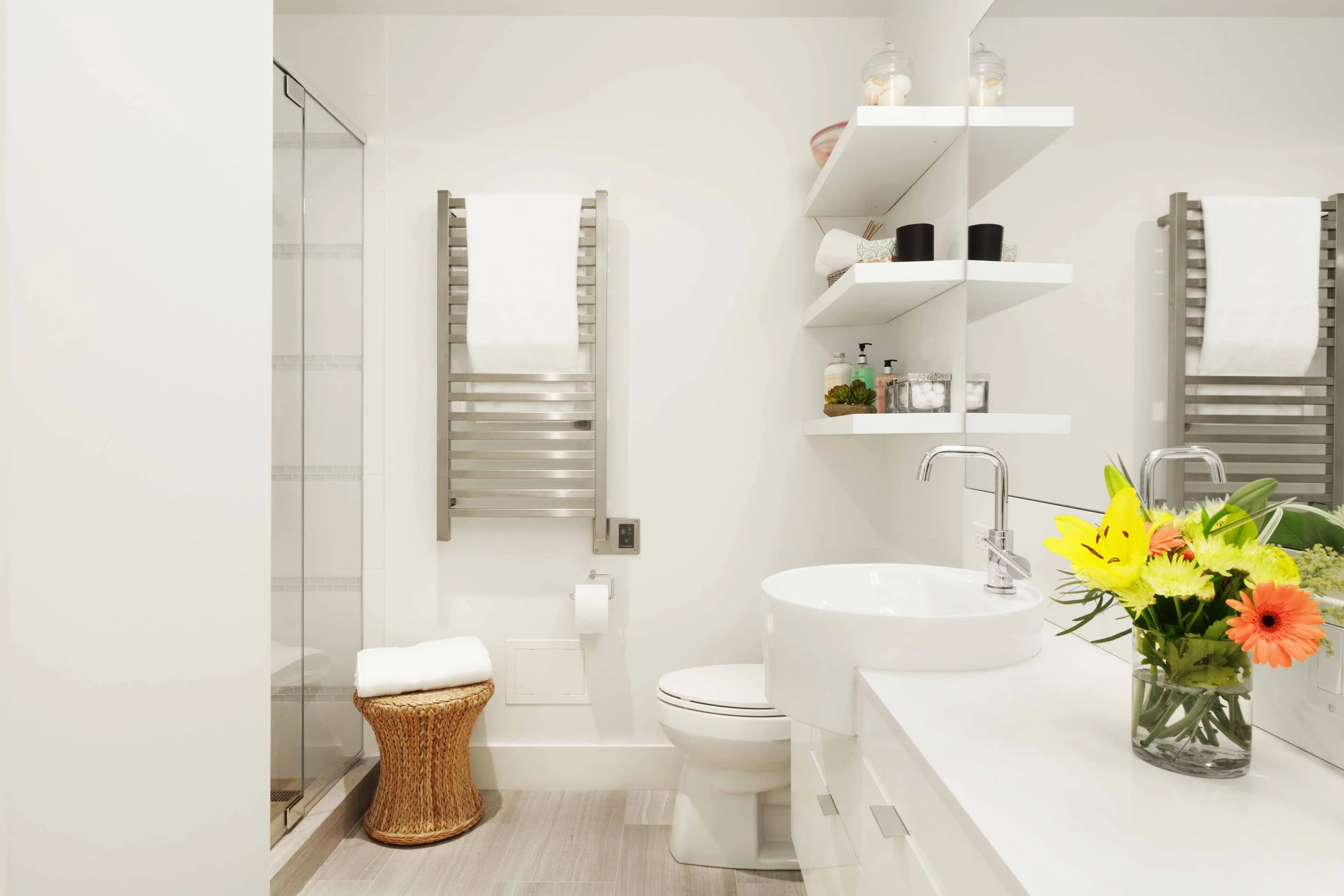 Modern primary bathroom featuring floating vanity, vessel sinks, and clean-lined finishes in Doyer Apartment in White Plains, NY by Luminosus Designs.