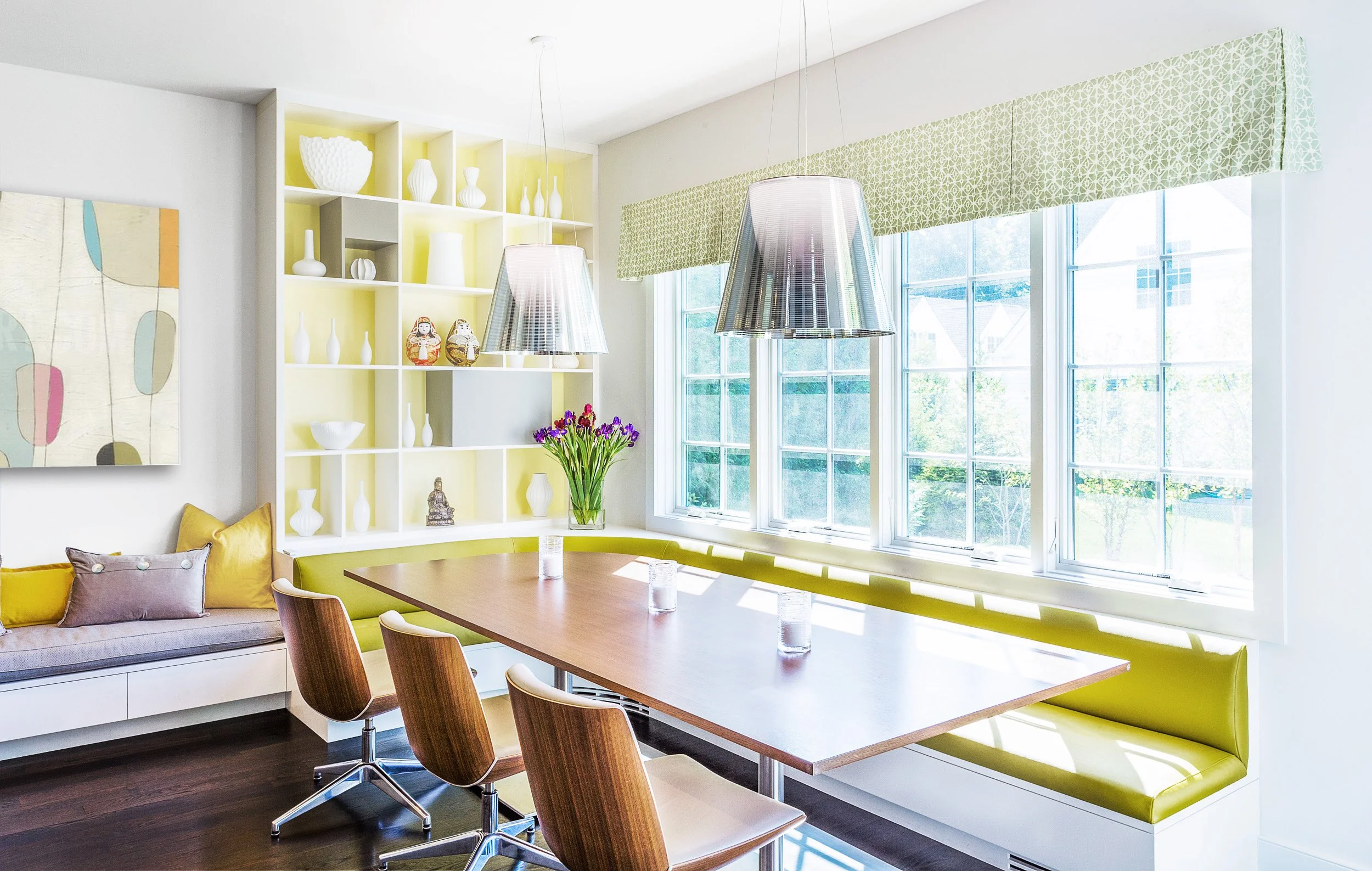Close-up view of dining chairs paired with the built-in banquette for casual breakfast seating.