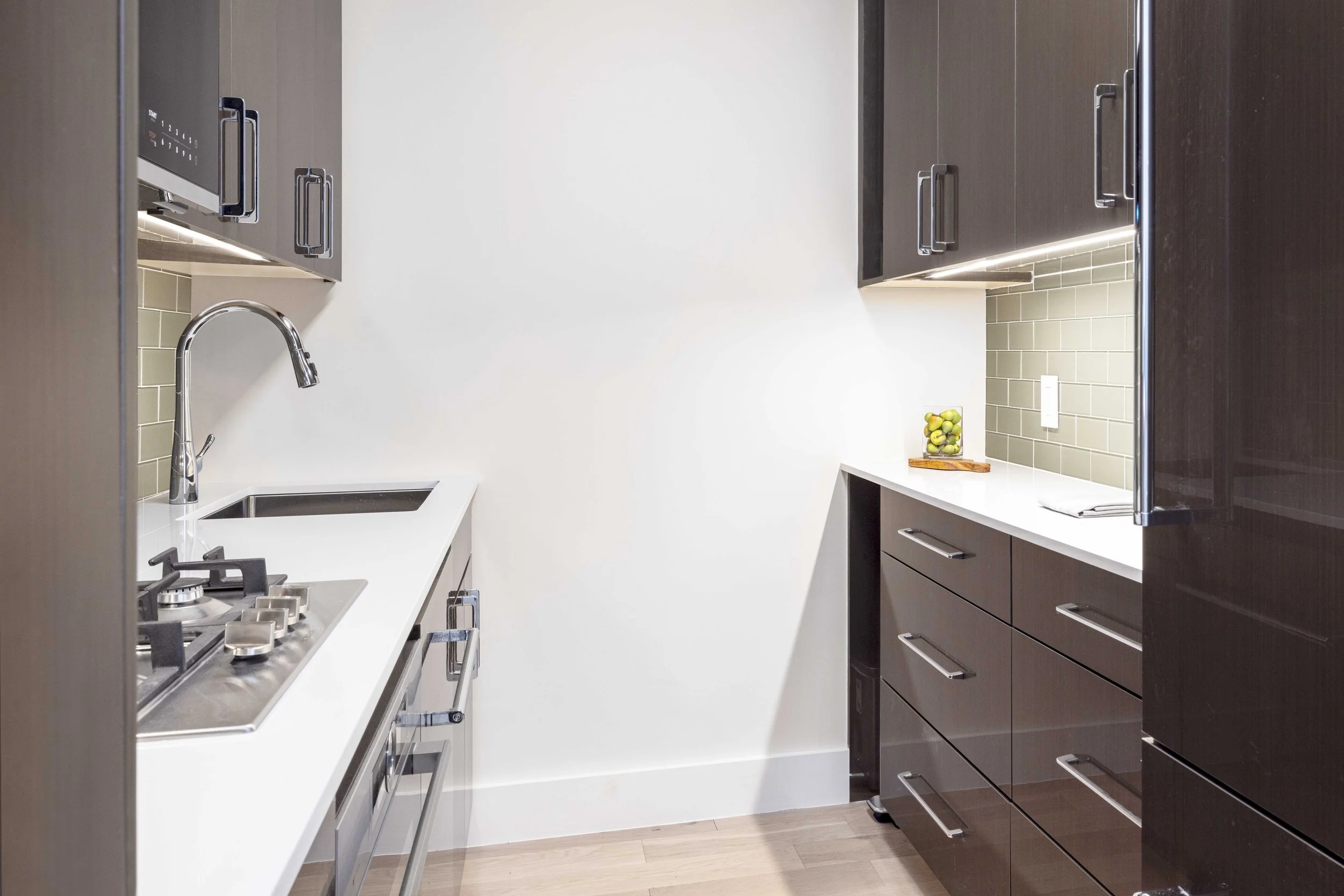 Alternative view of kitchen cabinetry and hardware in the Gramercy Arms apartment NYC.