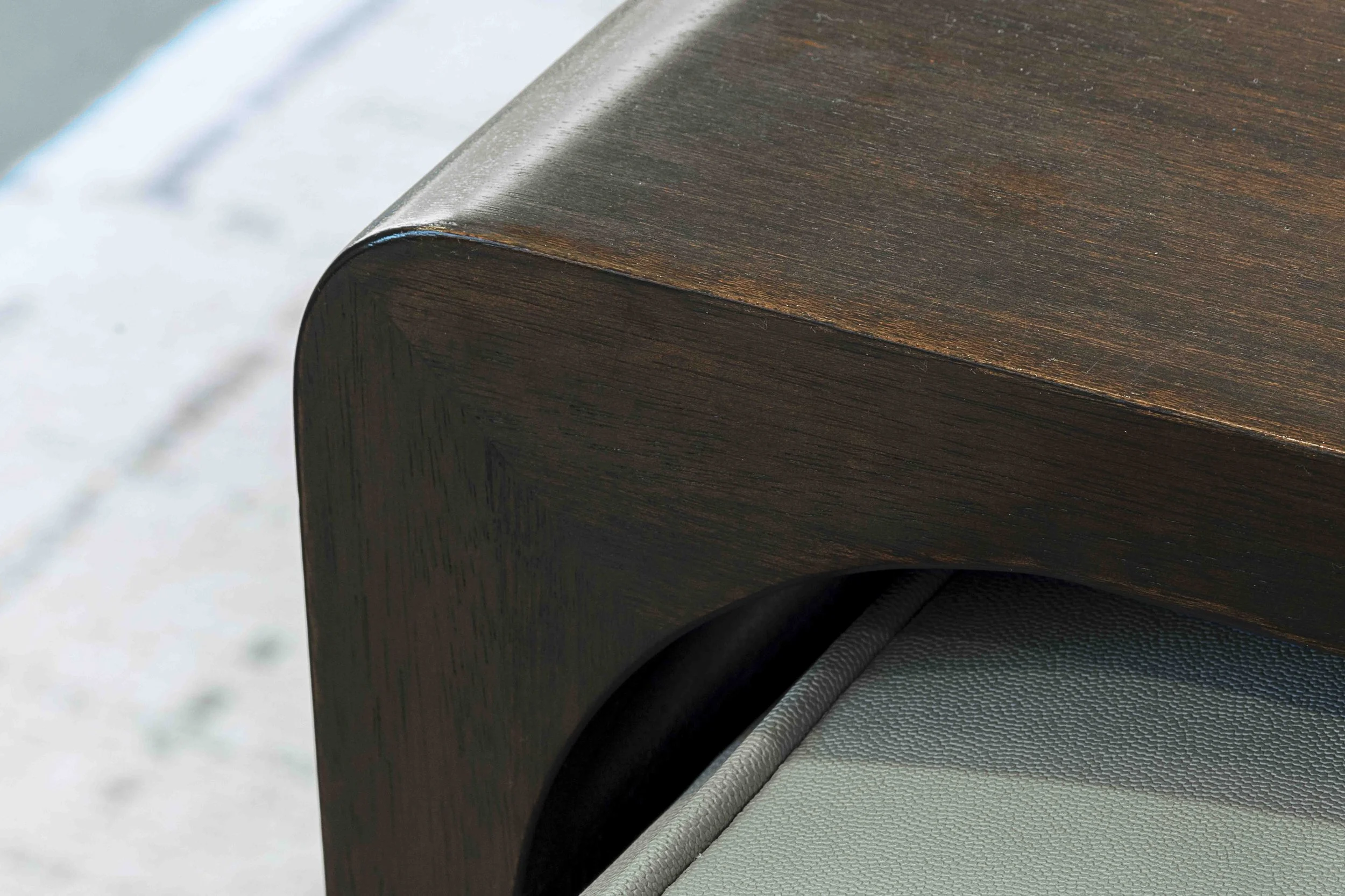 Detail view of custom coffee table in the Glen Oaks, Rye NY family room, emphasizing texture and finish.