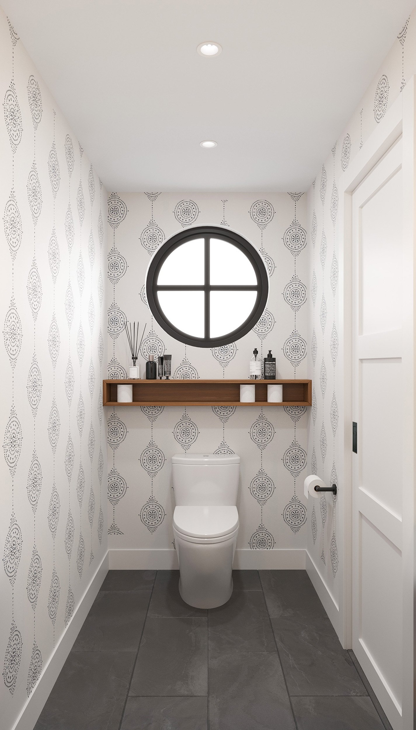 View of powder room toilet, wallpaper, and wall-mounted shelf in Nanny Hagen House in Thornwood, NY. 