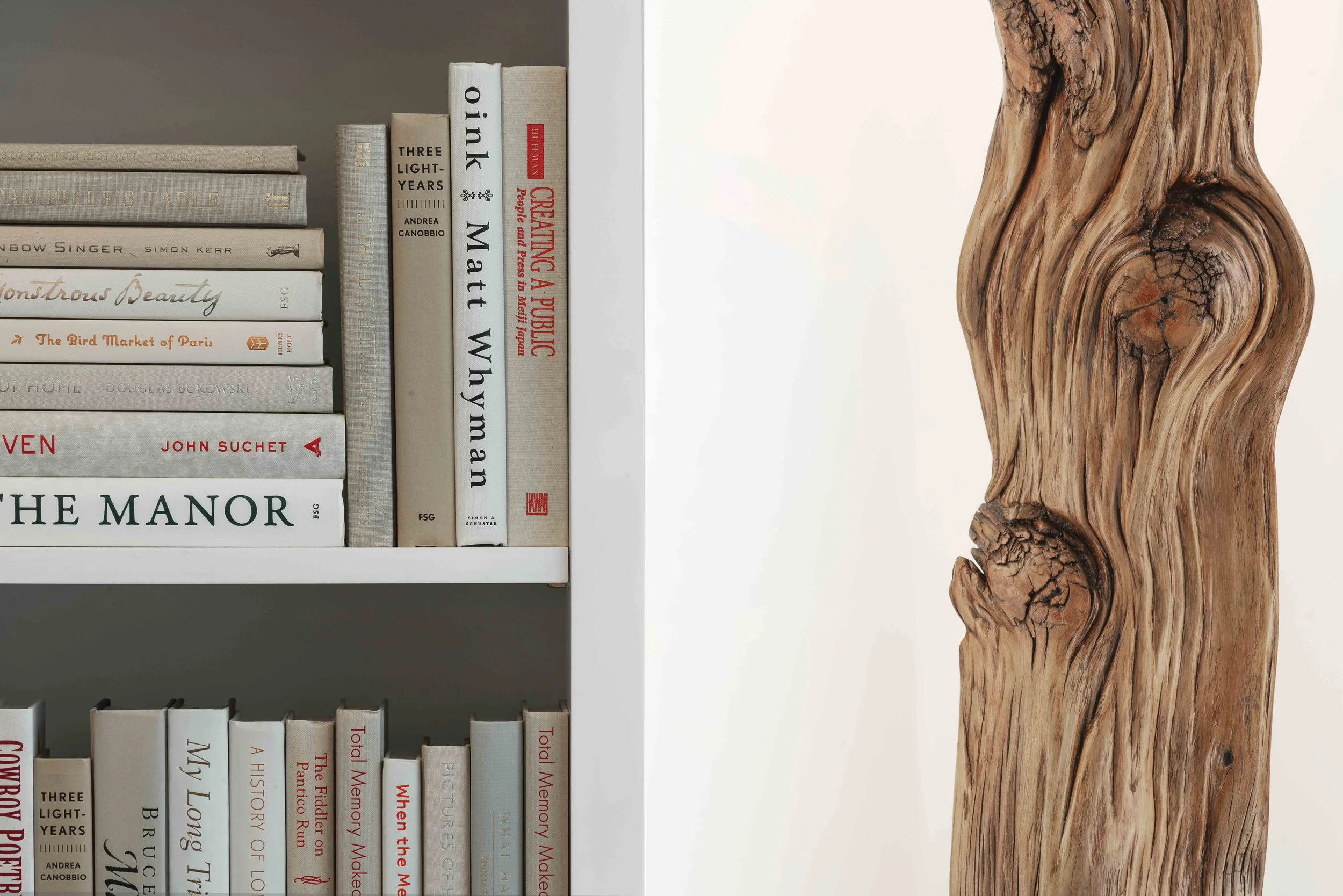 Detail view of styling and custom decoration in the media cabinet in the Glen Oaks, Rye NY family room, emphasizing texture and finish.