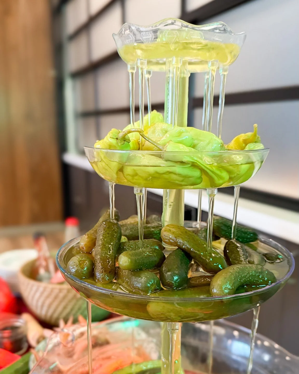 Yes, it&rsquo;s a pickle fountain! 🥒✨ With flowing pickle juice, house-made pickles, and a variety of hot sauces to pair. 🙌

Join us for dinner and don't miss out on our delicious pickle buffet! #PickleFountain #FoodieHeaven #DinnerGoals #PickleJar