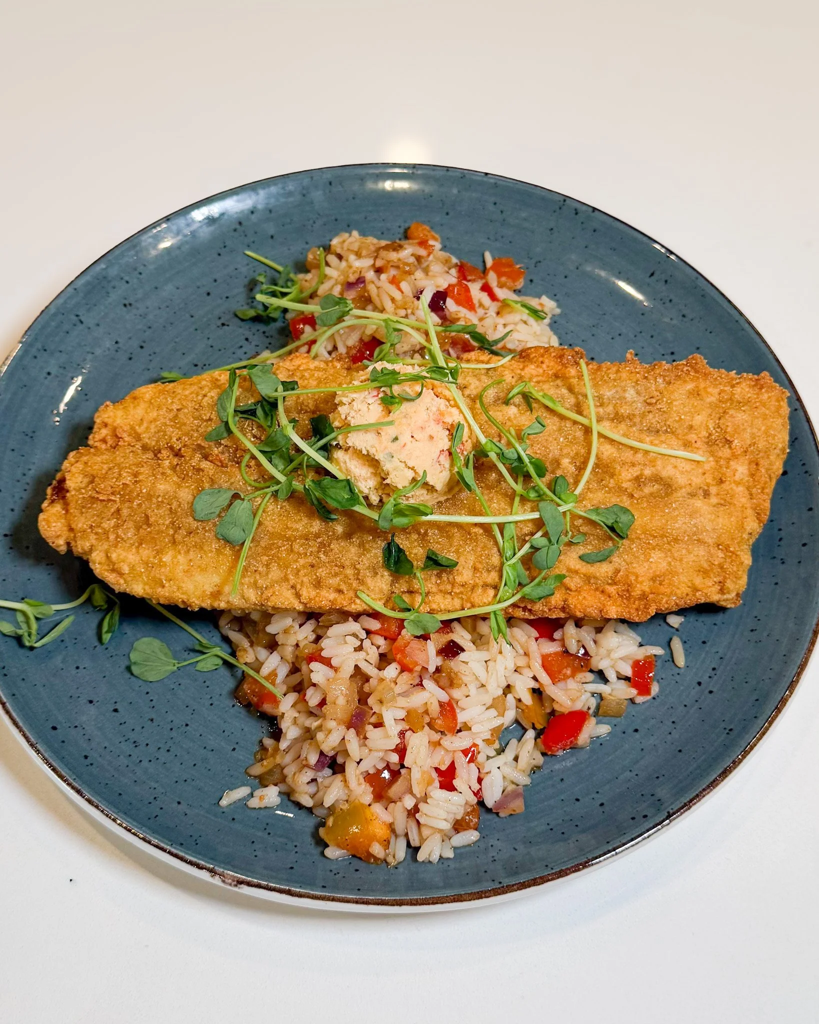 ✨ Crispy, comforting, and packed with flavour! ✨ 

Our Buttermilk Cornmeal Catfish is cornmeal-fried and served with pimento cheese sauce and Cajun rice, all done the Pickle Jar way. 😋🌽

Available for lunch and dinner, and we can't recommend it eno