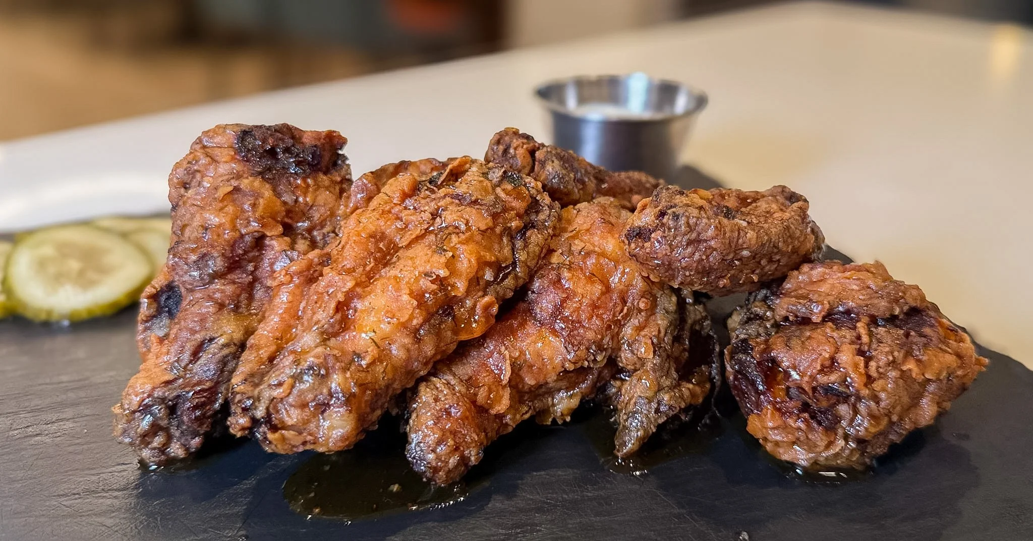🔥 These aren't your average wings! 🍗✨

Brined in zesty dill and fried to crispy perfection, our Dill Pickle Chicken Wings are served with a homemade dill dipping sauce. Choose your finishing touch: dill pickle seasoning salt, spicy dill pickle hot 